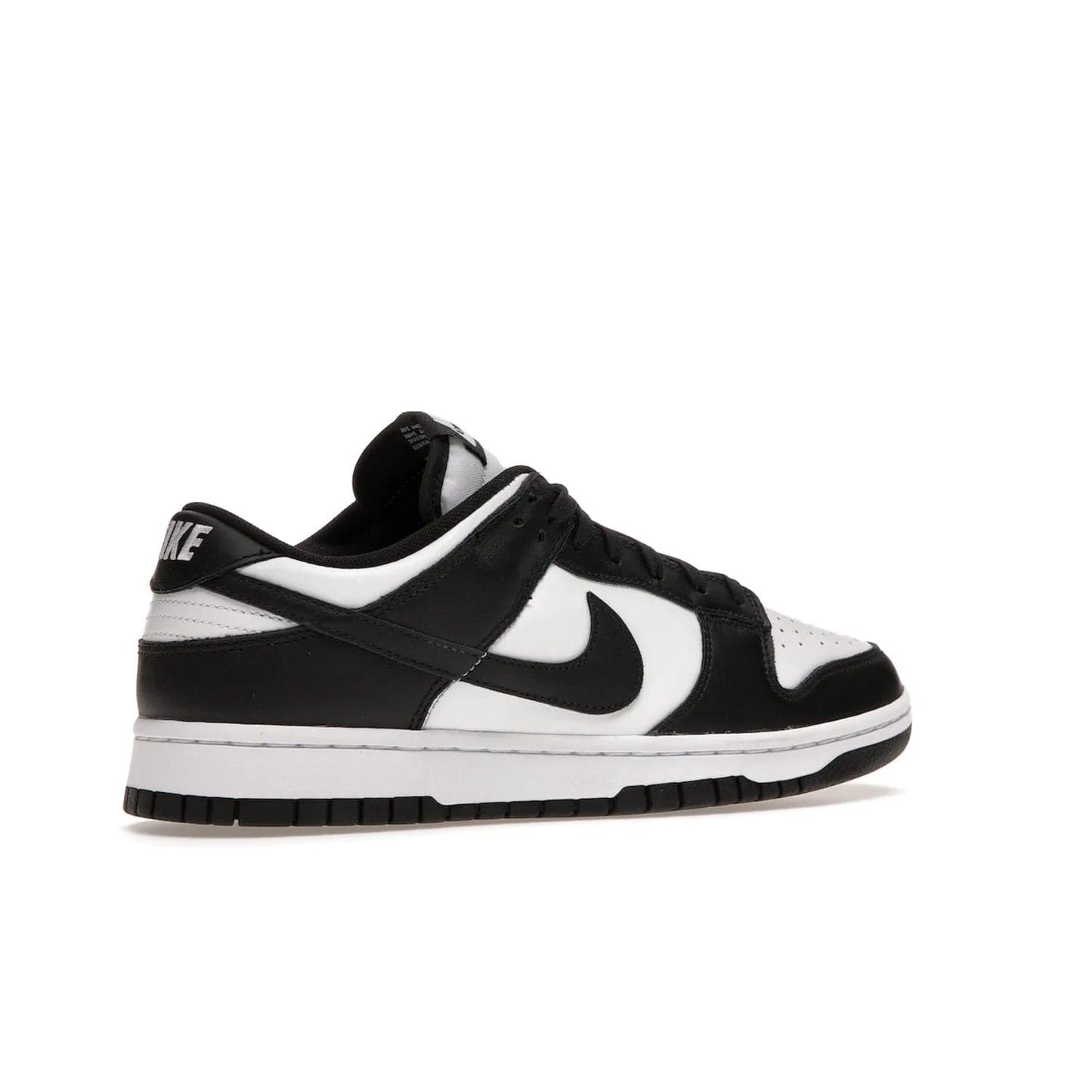 Nike Dunk Low Retro White Black Panda (2021) - Image 34 - Only at www.BallersClubKickz.com - Shop the Nike Dunk Low Retro White Black for classic styling featuring white leather with black leather overlays and classic Nike branding. Released in 2021, this timeless design offers a white midsole and black outsole for a stylish look. Shop all the Nike Dunks & rock this classic look.