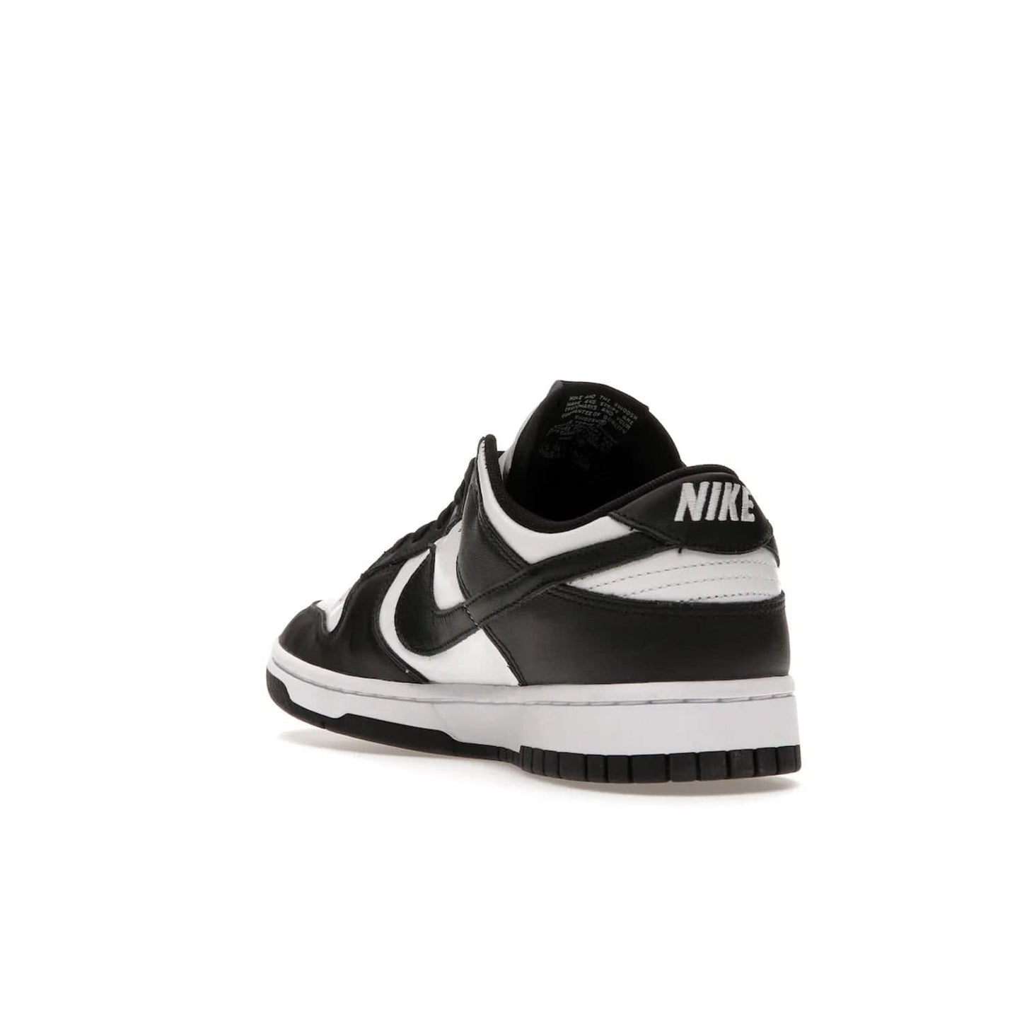 Nike Dunk Low Retro White Black Panda (2021) - Image 25 - Only at www.BallersClubKickz.com - Shop the Nike Dunk Low Retro White Black for classic styling featuring white leather with black leather overlays and classic Nike branding. Released in 2021, this timeless design offers a white midsole and black outsole for a stylish look. Shop all the Nike Dunks & rock this classic look.