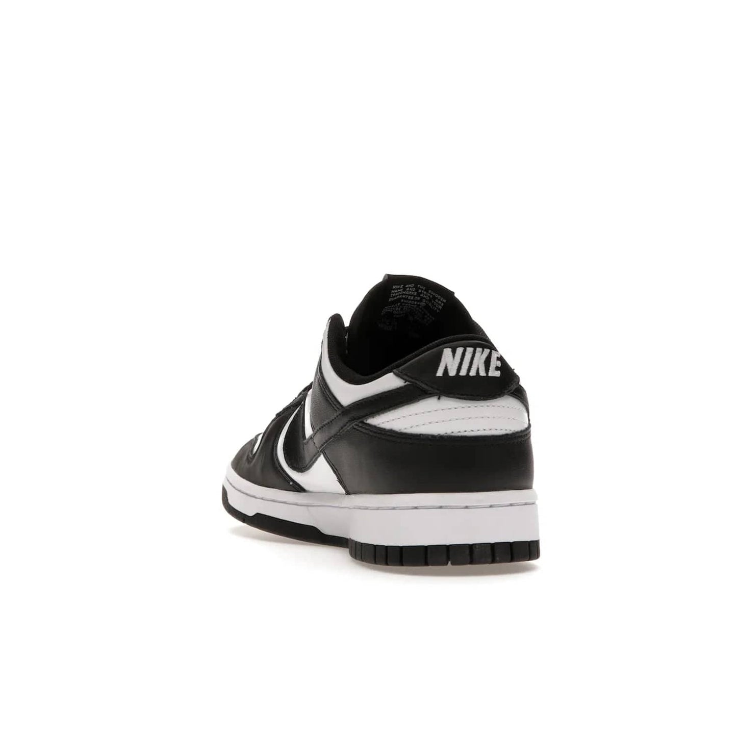 Nike Dunk Low Retro White Black Panda (2021) - Image 26 - Only at www.BallersClubKickz.com - Shop the Nike Dunk Low Retro White Black for classic styling featuring white leather with black leather overlays and classic Nike branding. Released in 2021, this timeless design offers a white midsole and black outsole for a stylish look. Shop all the Nike Dunks & rock this classic look.