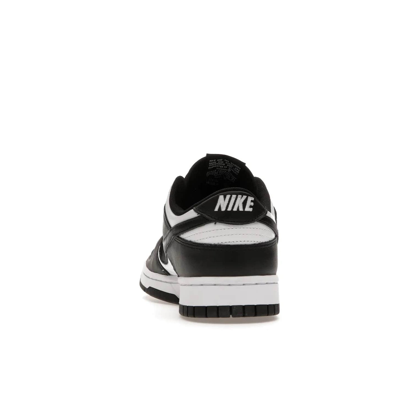 Nike Dunk Low Retro White Black Panda (2021) - Image 27 - Only at www.BallersClubKickz.com - Shop the Nike Dunk Low Retro White Black for classic styling featuring white leather with black leather overlays and classic Nike branding. Released in 2021, this timeless design offers a white midsole and black outsole for a stylish look. Shop all the Nike Dunks & rock this classic look.