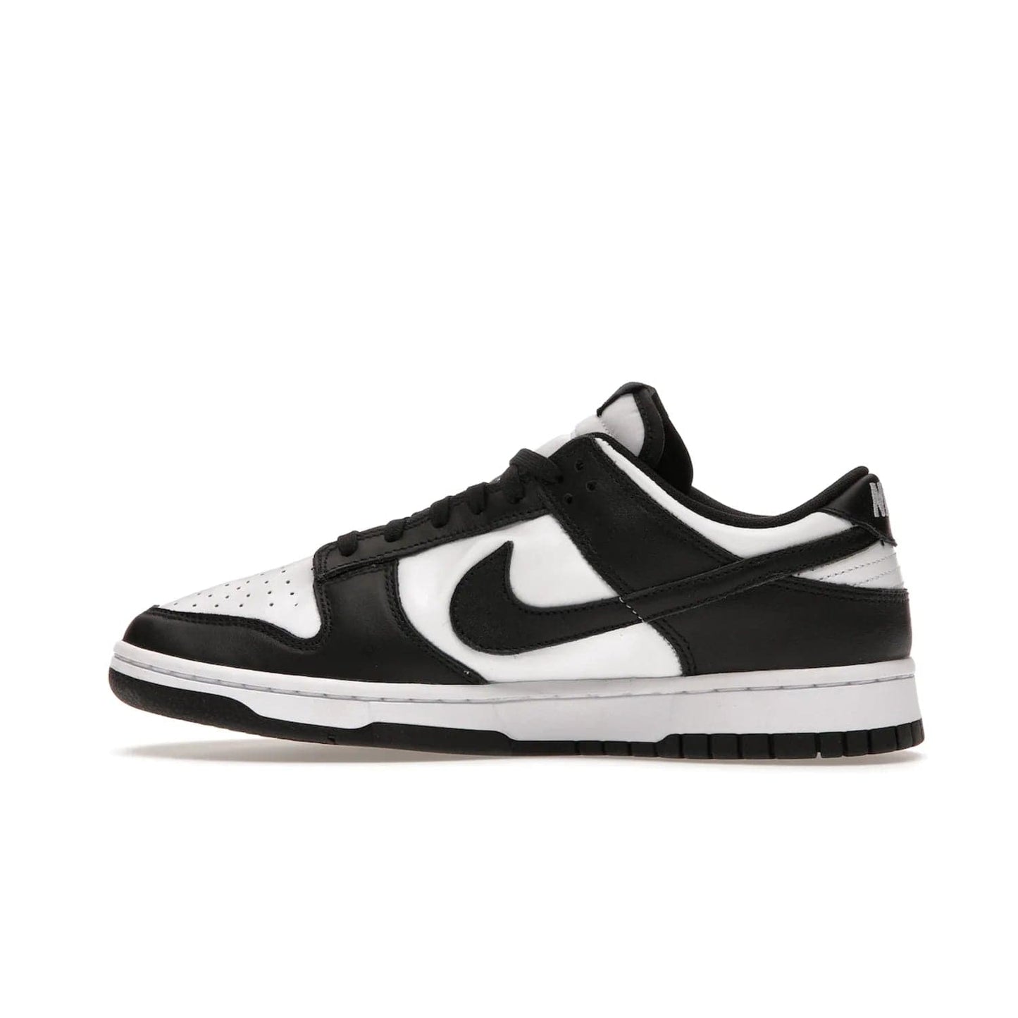 Nike Dunk Low Retro White Black Panda (2021) - Image 20 - Only at www.BallersClubKickz.com - Shop the Nike Dunk Low Retro White Black for classic styling featuring white leather with black leather overlays and classic Nike branding. Released in 2021, this timeless design offers a white midsole and black outsole for a stylish look. Shop all the Nike Dunks & rock this classic look.