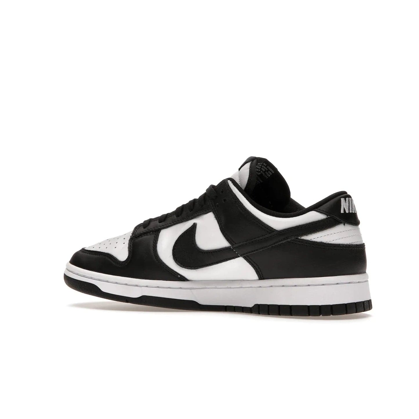 Nike Dunk Low Retro White Black Panda (2021) - Image 22 - Only at www.BallersClubKickz.com - Shop the Nike Dunk Low Retro White Black for classic styling featuring white leather with black leather overlays and classic Nike branding. Released in 2021, this timeless design offers a white midsole and black outsole for a stylish look. Shop all the Nike Dunks & rock this classic look.