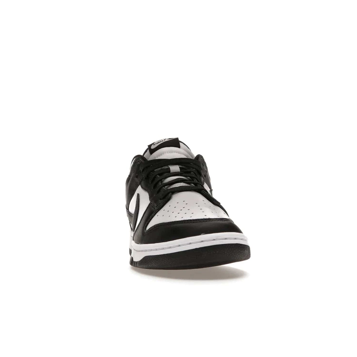 Nike Dunk Low Retro White Black Panda (2021) - Image 9 - Only at www.BallersClubKickz.com - Shop the Nike Dunk Low Retro White Black for classic styling featuring white leather with black leather overlays and classic Nike branding. Released in 2021, this timeless design offers a white midsole and black outsole for a stylish look. Shop all the Nike Dunks & rock this classic look.