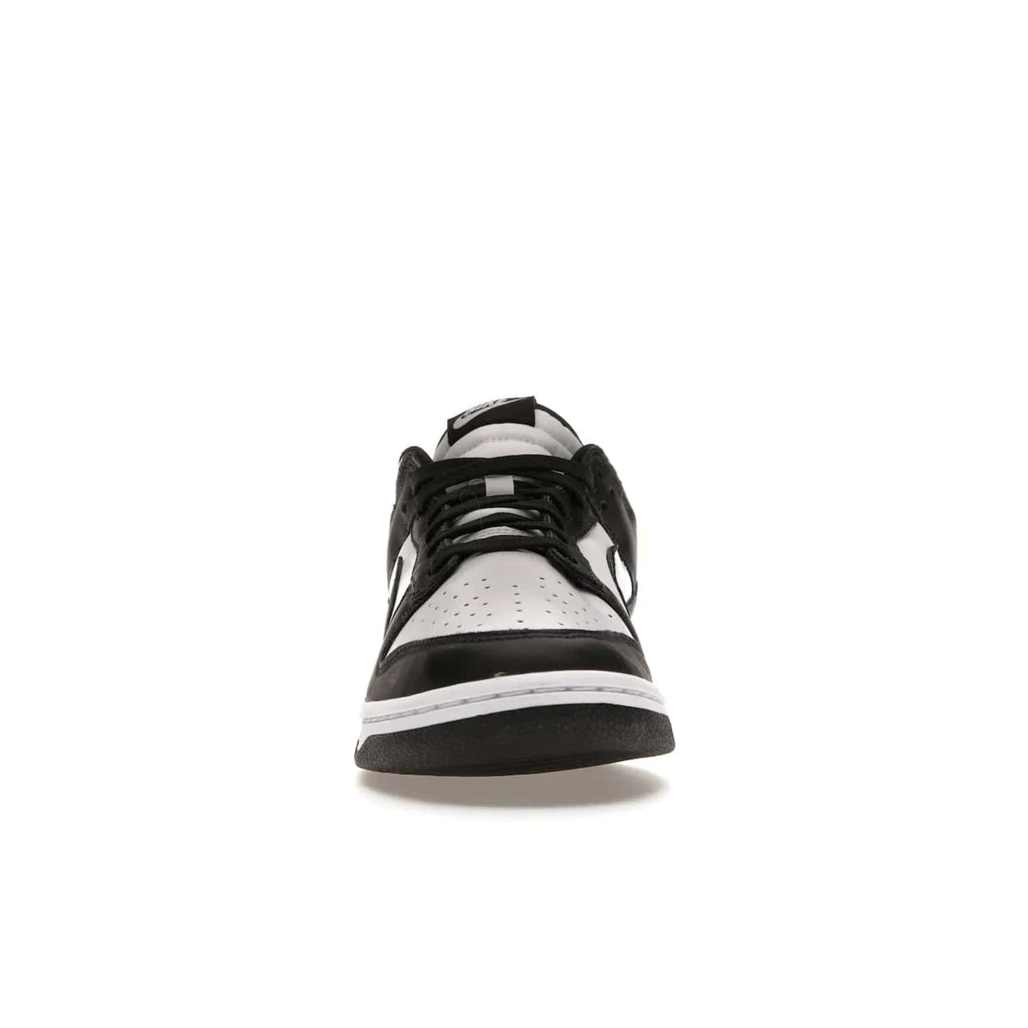 Nike Dunk Low Retro White Black Panda (2021) - Image 10 - Only at www.BallersClubKickz.com - Shop the Nike Dunk Low Retro White Black for classic styling featuring white leather with black leather overlays and classic Nike branding. Released in 2021, this timeless design offers a white midsole and black outsole for a stylish look. Shop all the Nike Dunks & rock this classic look.