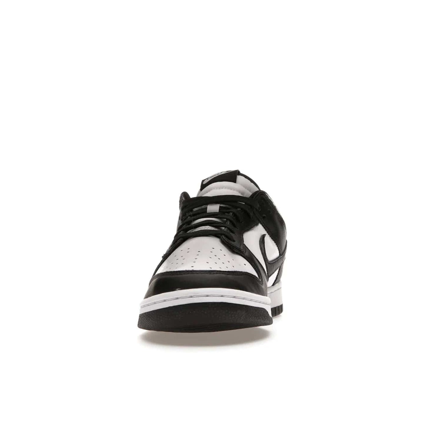 Nike Dunk Low Retro White Black Panda (2021) - Image 11 - Only at www.BallersClubKickz.com - Shop the Nike Dunk Low Retro White Black for classic styling featuring white leather with black leather overlays and classic Nike branding. Released in 2021, this timeless design offers a white midsole and black outsole for a stylish look. Shop all the Nike Dunks & rock this classic look.