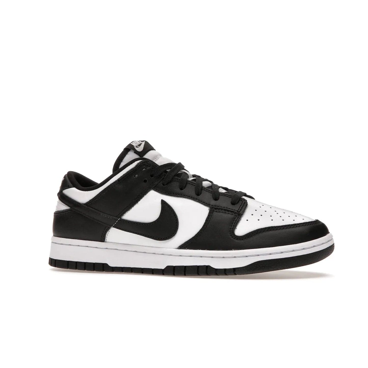 Nike Dunk Low Retro White Black Panda (2021) - Image 3 - Only at www.BallersClubKickz.com - Shop the Nike Dunk Low Retro White Black for classic styling featuring white leather with black leather overlays and classic Nike branding. Released in 2021, this timeless design offers a white midsole and black outsole for a stylish look. Shop all the Nike Dunks & rock this classic look.
