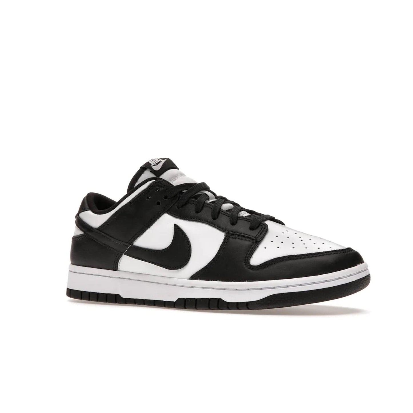 Nike Dunk Low Retro White Black Panda (2021) - Image 4 - Only at www.BallersClubKickz.com - Shop the Nike Dunk Low Retro White Black for classic styling featuring white leather with black leather overlays and classic Nike branding. Released in 2021, this timeless design offers a white midsole and black outsole for a stylish look. Shop all the Nike Dunks & rock this classic look.