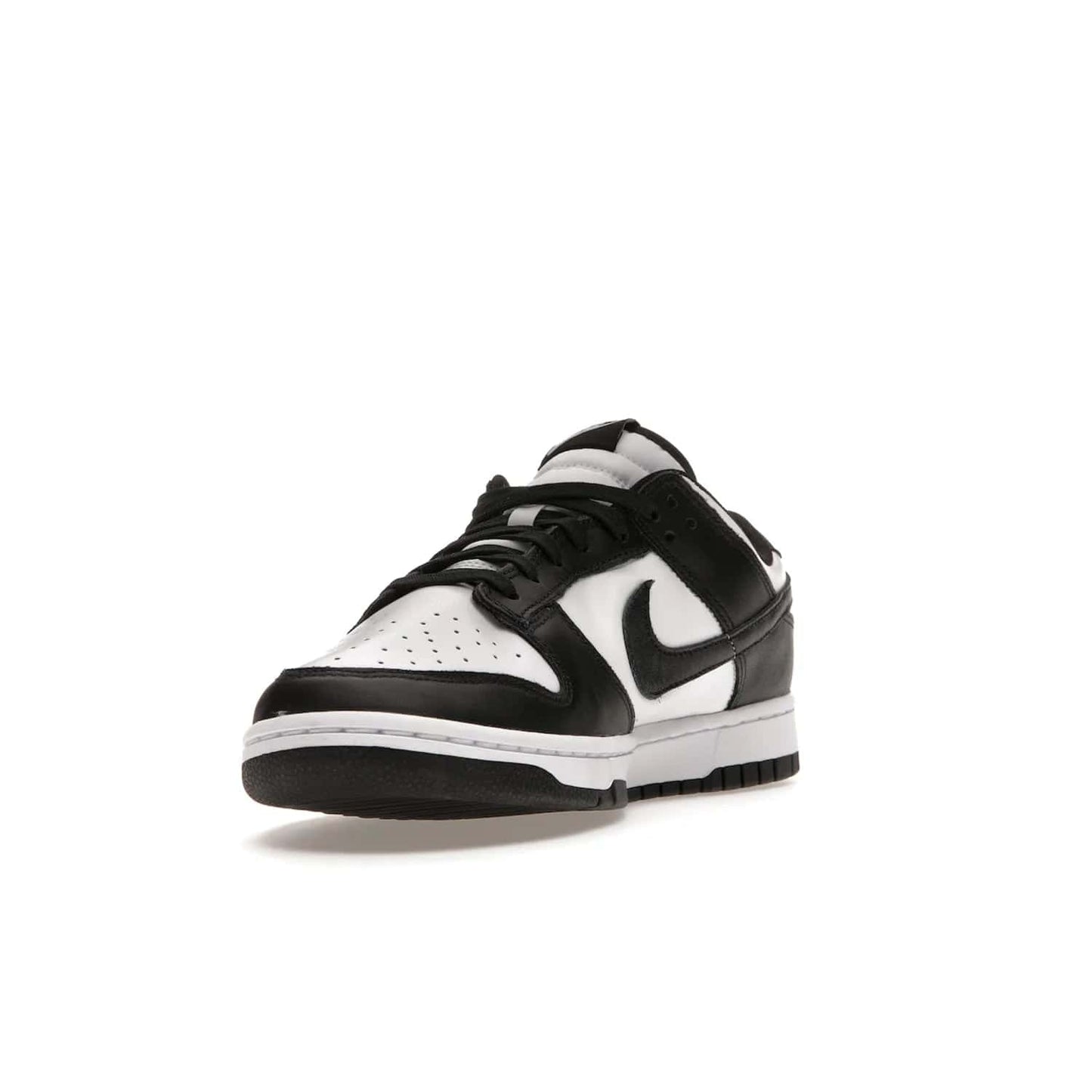Nike Dunk Low Retro White Black Panda (2021) - Image 13 - Only at www.BallersClubKickz.com - Shop the Nike Dunk Low Retro White Black for classic styling featuring white leather with black leather overlays and classic Nike branding. Released in 2021, this timeless design offers a white midsole and black outsole for a stylish look. Shop all the Nike Dunks & rock this classic look.