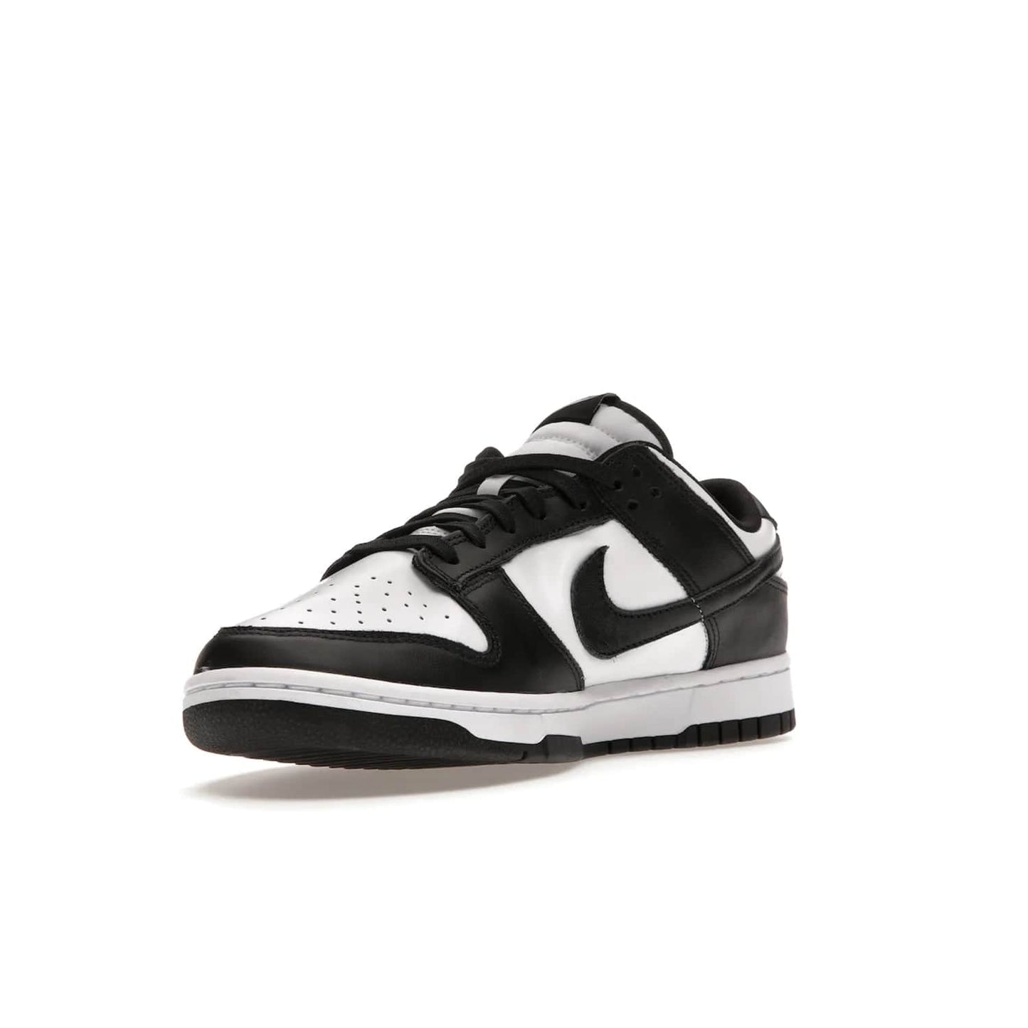 Nike Dunk Low Retro White Black Panda (2021) - Image 14 - Only at www.BallersClubKickz.com - Shop the Nike Dunk Low Retro White Black for classic styling featuring white leather with black leather overlays and classic Nike branding. Released in 2021, this timeless design offers a white midsole and black outsole for a stylish look. Shop all the Nike Dunks & rock this classic look.