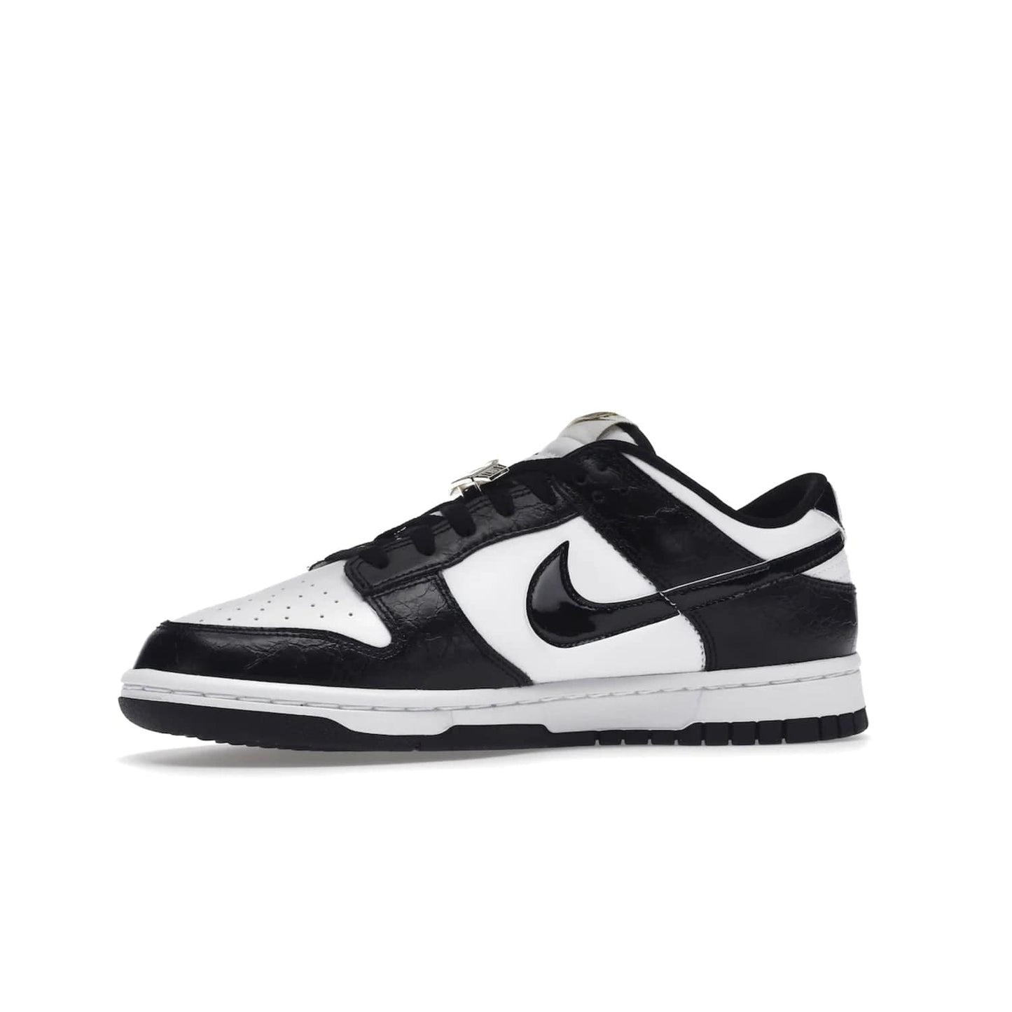 Nike Dunk Low SE World Champs Black White - Image 17 - Only at www.BallersClubKickz.com - Step up your look with the Nike Dunk Low SE World Champs Black White. Leather base, lace eyelets, Swoosh design, gold-stitched brand, and black and gold lace dubraes. Get it in May 2022 for $120.
