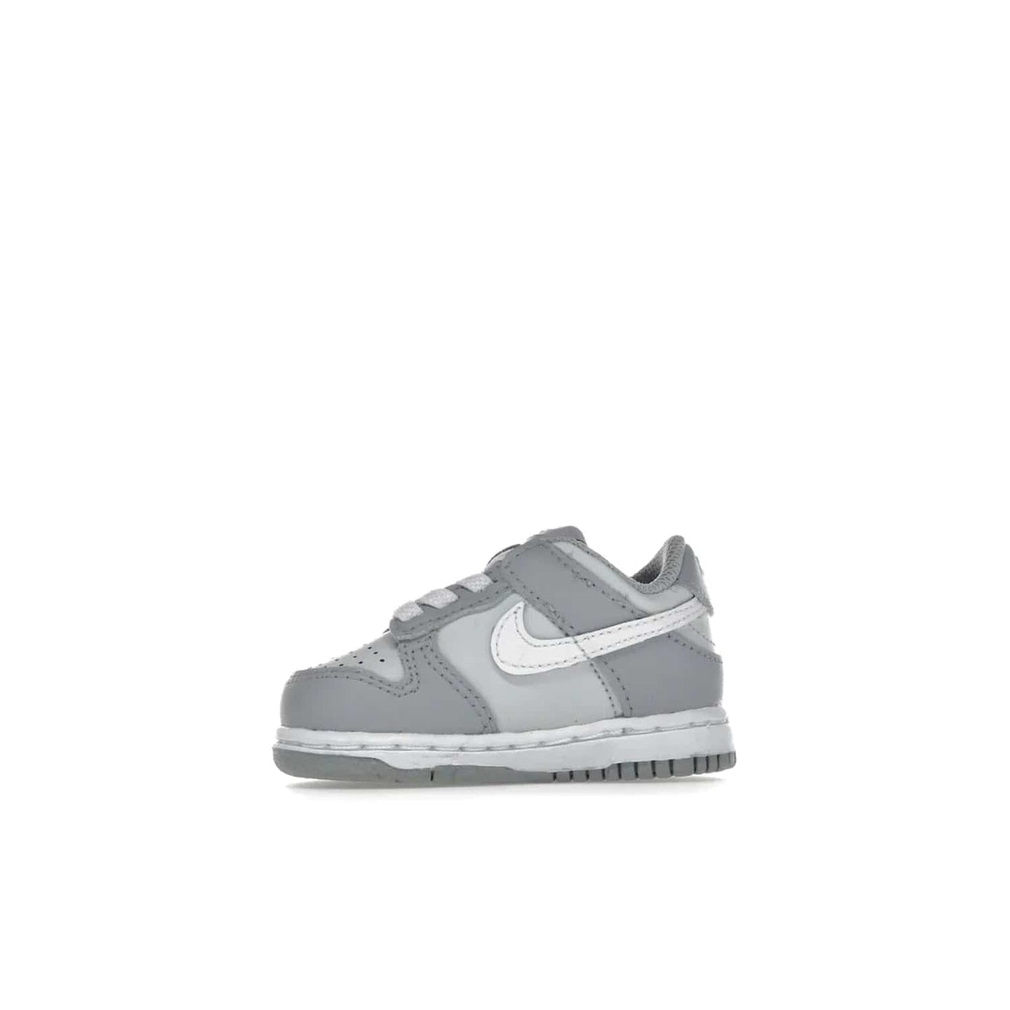 Nike Dunk Low Two-Toned Grey (TD) - Image 18 - Only at www.BallersClubKickz.com - Clean and sharp Nike Dunk Low Two-Toned Grey (TD) release on March 1, 2022. Pure Platinum and White-Wolf Grey design with extra-cushioned midsole for optimal comfort and style.