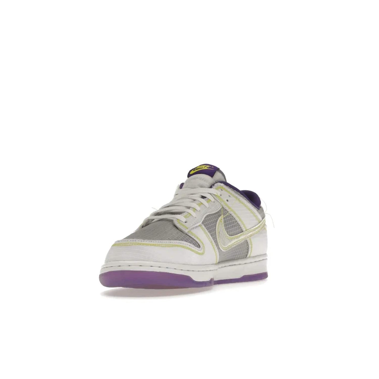Nike Dunk Low Union Passport Pack Court Purple - Image 13 - Only at www.BallersClubKickz.com - Nike Dunk Low Union LA Passport Pack Court Purple features Court Purple and white smooth leather construction and Union LA Frontman logo on the heel. Releasing in April of 2022, this iconic shoe will make a splash in the streetwear world.