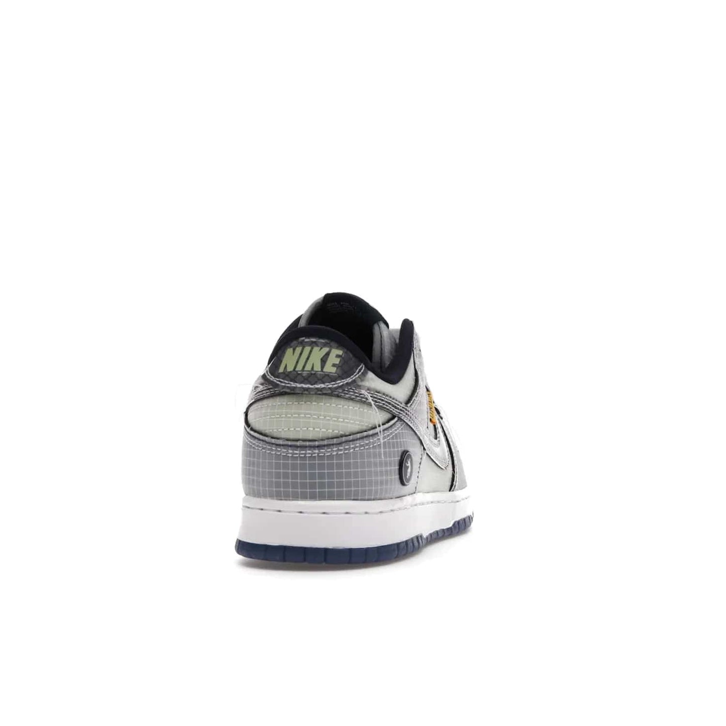 Nike Dunk Low Union Passport Pack Pistachio - Image 29 - Only at www.BallersClubKickz.com - Shop the Nike Dunk Low Union Passport Pack Pistachio! This statement-making silhouette combines light green and navy leather with a semi-translucent ripstop nylon. Comes with exclusive Walter Lee Young-inspired emblem at the heel and a yellow Union LA tab on the quarter panel. Releasing February 2022.