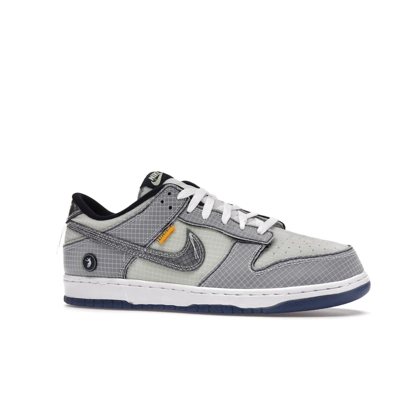 Nike Dunk Low Union Passport Pack Pistachio - Image 3 - Only at www.BallersClubKickz.com - Shop the Nike Dunk Low Union Passport Pack Pistachio! This statement-making silhouette combines light green and navy leather with a semi-translucent ripstop nylon. Comes with exclusive Walter Lee Young-inspired emblem at the heel and a yellow Union LA tab on the quarter panel. Releasing February 2022.