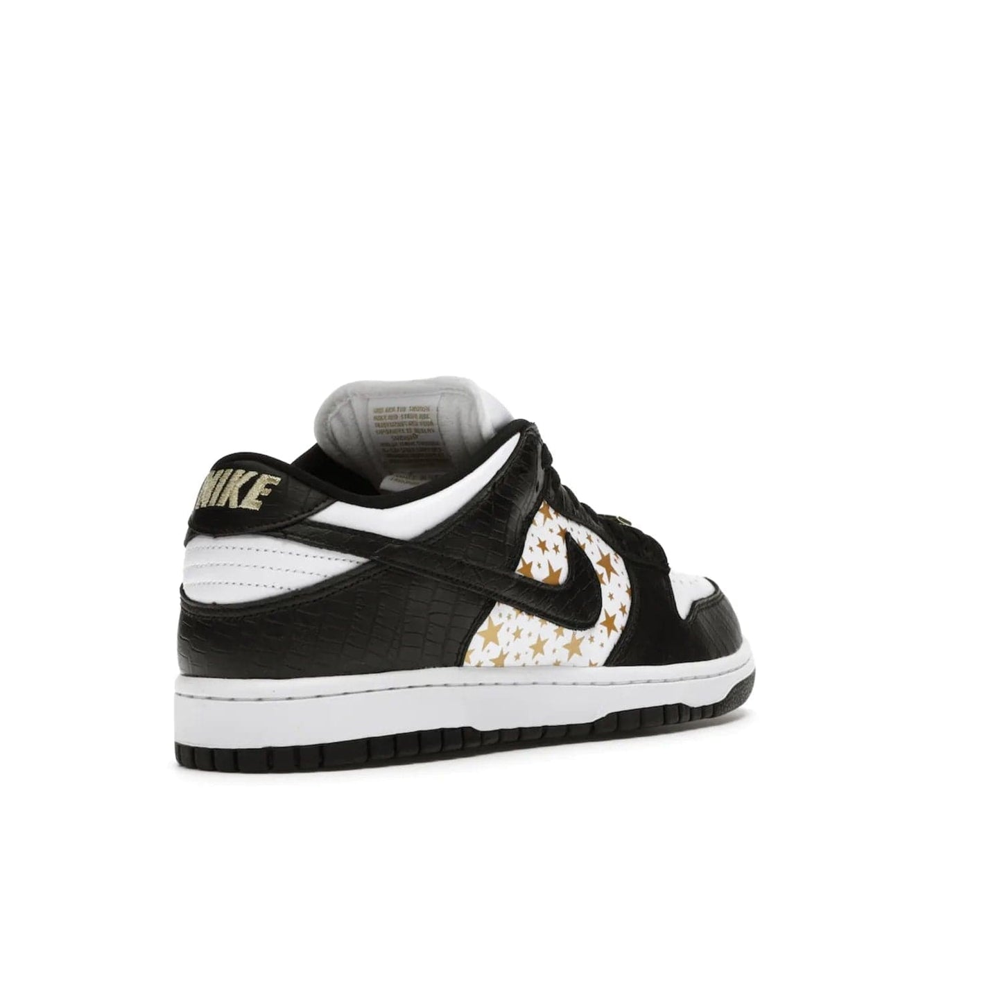 Nike SB Dunk Low Supreme Stars Black (2021) - Image 32 - Only at www.BallersClubKickz.com - Retro style and signature details make the Nike SB Dunk Low Supreme Black a must-have. This special edition shoe features a white leather upper and black croc skin overlays complemented by gold stars and deubré. Enjoy a piece of SB history and grab yours today.