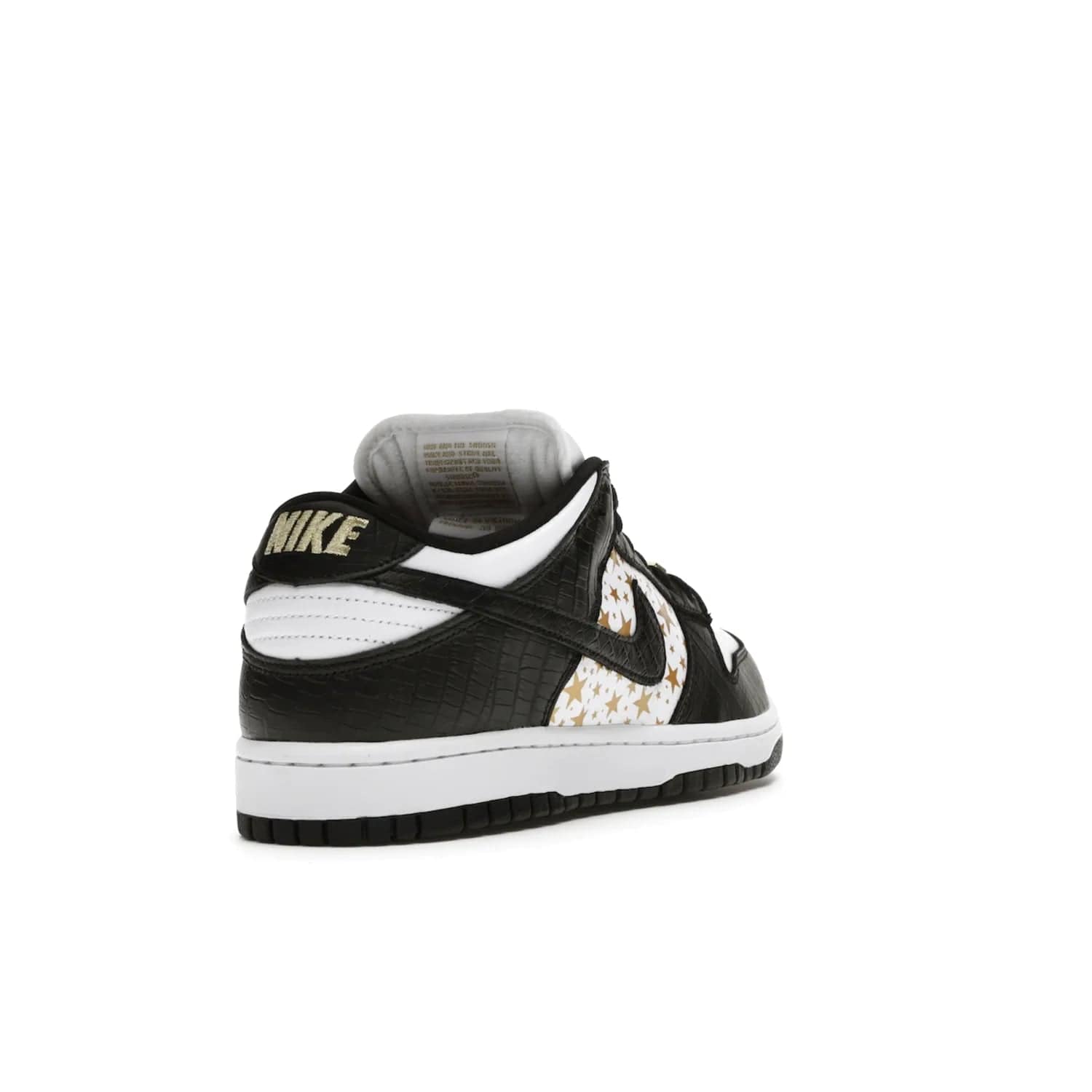 Nike SB Dunk Low Supreme Stars Black (2021) - Image 31 - Only at www.BallersClubKickz.com - Retro style and signature details make the Nike SB Dunk Low Supreme Black a must-have. This special edition shoe features a white leather upper and black croc skin overlays complemented by gold stars and deubré. Enjoy a piece of SB history and grab yours today.