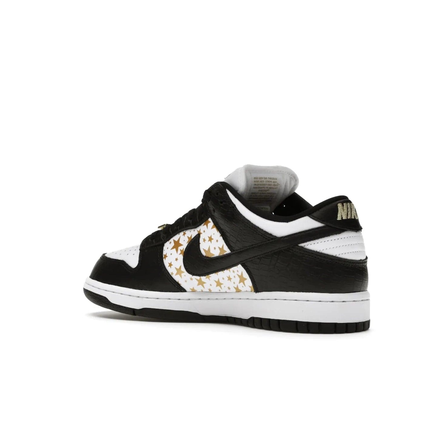 Nike SB Dunk Low Supreme Stars Black (2021) - Image 23 - Only at www.BallersClubKickz.com - Retro style and signature details make the Nike SB Dunk Low Supreme Black a must-have. This special edition shoe features a white leather upper and black croc skin overlays complemented by gold stars and deubré. Enjoy a piece of SB history and grab yours today.