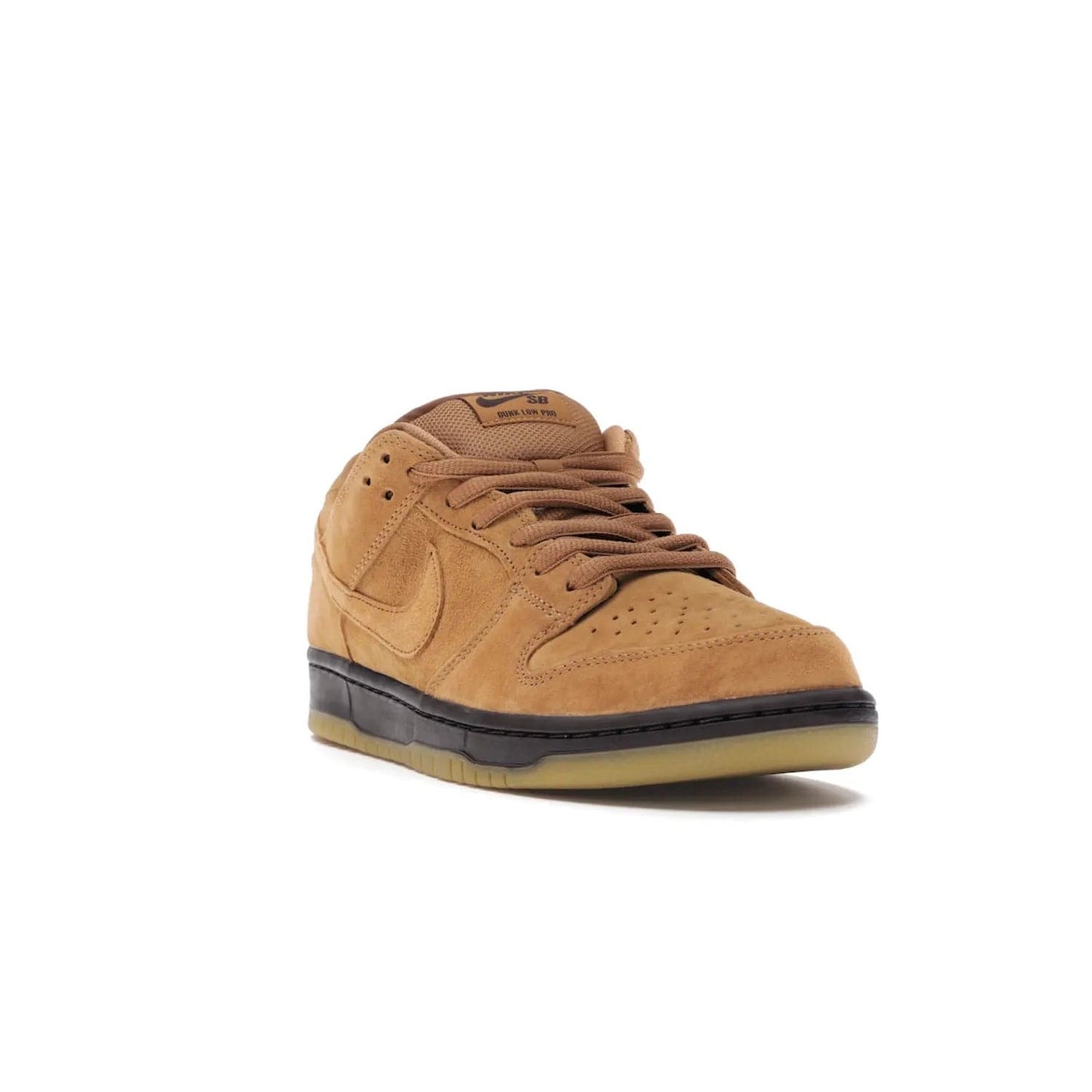 Nike SB Dunk Low Wheat (2021/2023) - Image 7 - Only at www.BallersClubKickz.com - The Nike SB Dunk Low Wheat (2021/2023)has a sleek silhouette and wheat suede upper. Tan tones for lining, mesh tongues, and laces. Iconic color palette midsole, perforated boxing toe. Brown branding on tongue and heel. Gum rubber outsole with partitioned pattern for traction. Eschewed in Feb 2021 for $110.