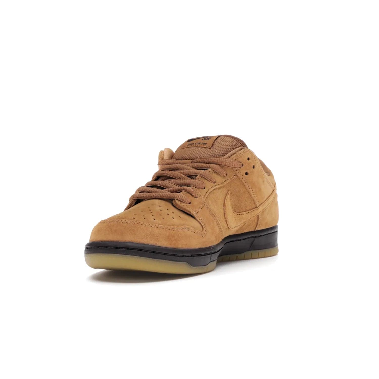 Nike SB Dunk Low Wheat (2021/2023) - Image 13 - Only at www.BallersClubKickz.com - The Nike SB Dunk Low Wheat (2021/2023)has a sleek silhouette and wheat suede upper. Tan tones for lining, mesh tongues, and laces. Iconic color palette midsole, perforated boxing toe. Brown branding on tongue and heel. Gum rubber outsole with partitioned pattern for traction. Eschewed in Feb 2021 for $110.