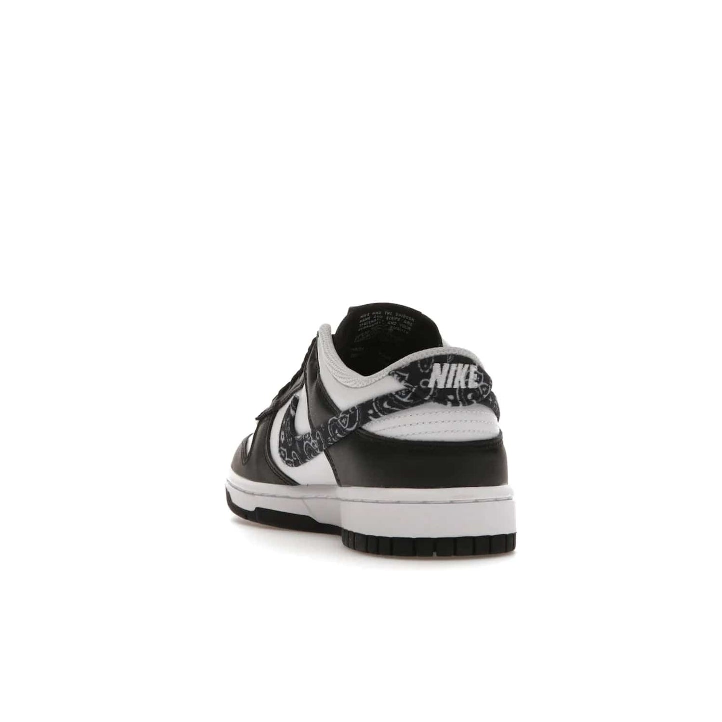 Nike Dunk Low Essential Paisley Pack Black (Women's) - Image 26 - Only at www.BallersClubKickz.com - Make a statement with the all-black Nike Dunk Low Essential Paisley Pack Black (Women's) featuring white leather overlays, a stunning paisley bandana print, and a white midsole for comfort and optimal grip on any surface.