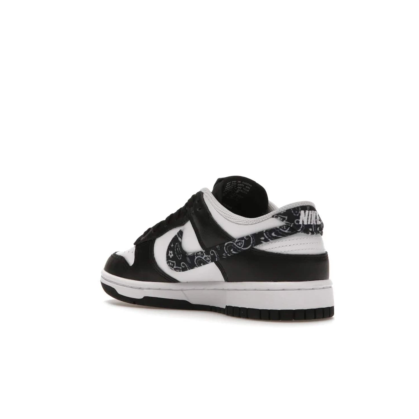 Nike Dunk Low Essential Paisley Pack Black (Women's) - Image 24 - Only at www.BallersClubKickz.com - Make a statement with the all-black Nike Dunk Low Essential Paisley Pack Black (Women's) featuring white leather overlays, a stunning paisley bandana print, and a white midsole for comfort and optimal grip on any surface.