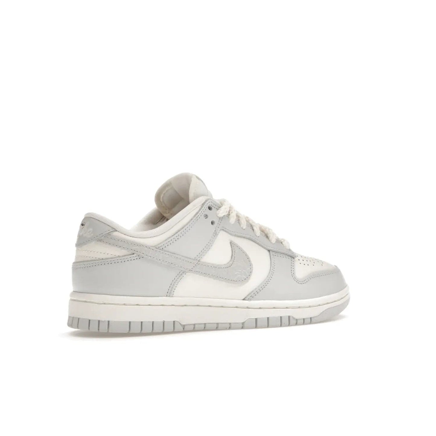 Nike Dunk Low Needlework Sail Aura (Women's) - Image 34 - Only at www.BallersClubKickz.com - Discover the Nike Dunk Low Needlework Sail Aura for Women. Boasting a beautiful Sail and Neutral Grey upper, this stylish sneaker offers durable materials with ultra-soft cushioning for all-day comfort. Get your pair today!