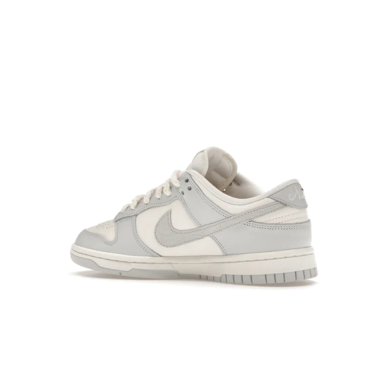 Nike Dunk Low Needlework Sail Aura (Women's) - Image 22 - Only at www.BallersClubKickz.com - Discover the Nike Dunk Low Needlework Sail Aura for Women. Boasting a beautiful Sail and Neutral Grey upper, this stylish sneaker offers durable materials with ultra-soft cushioning for all-day comfort. Get your pair today!