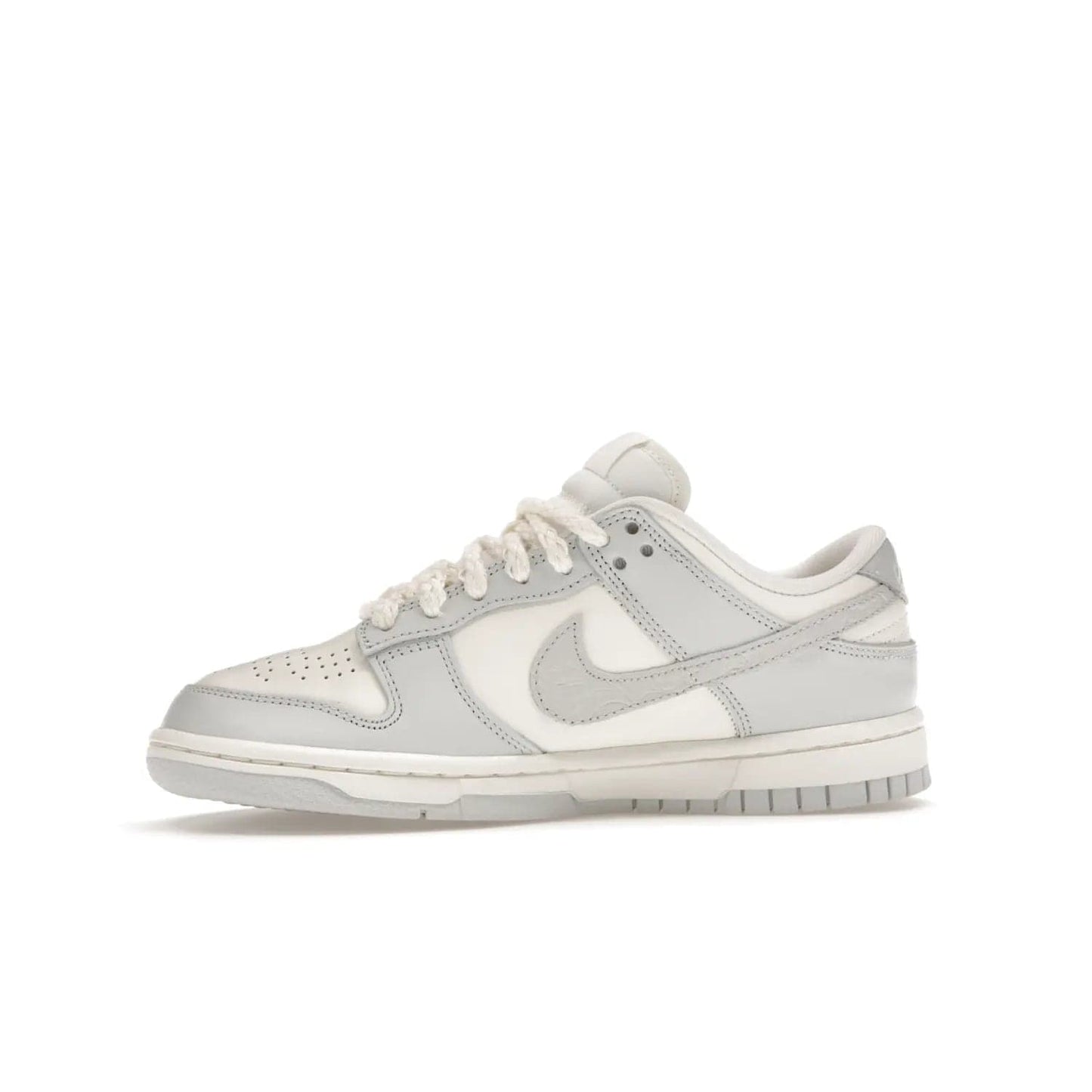 Nike Dunk Low Needlework Sail Aura (Women's) - Image 18 - Only at www.BallersClubKickz.com - Discover the Nike Dunk Low Needlework Sail Aura for Women. Boasting a beautiful Sail and Neutral Grey upper, this stylish sneaker offers durable materials with ultra-soft cushioning for all-day comfort. Get your pair today!