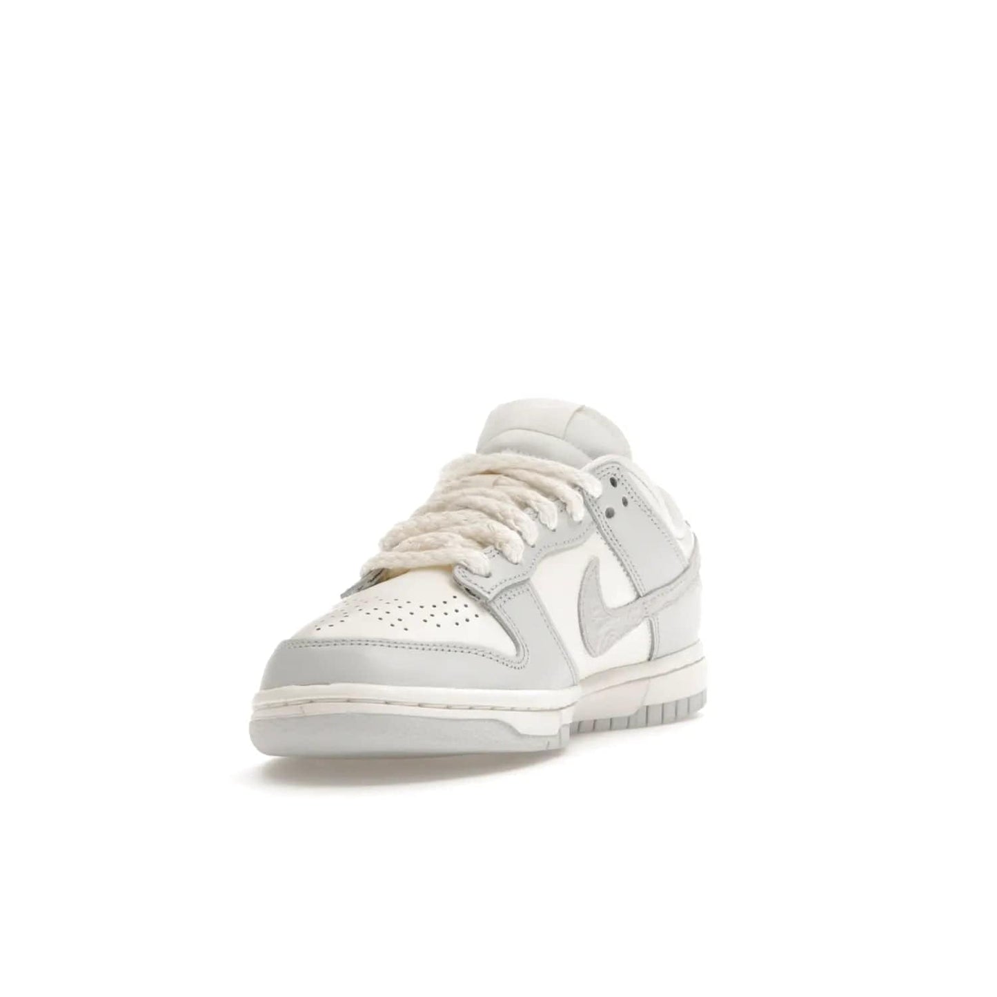 Nike Dunk Low Needlework Sail Aura (Women's) - Image 13 - Only at www.BallersClubKickz.com - Discover the Nike Dunk Low Needlework Sail Aura for Women. Boasting a beautiful Sail and Neutral Grey upper, this stylish sneaker offers durable materials with ultra-soft cushioning for all-day comfort. Get your pair today!