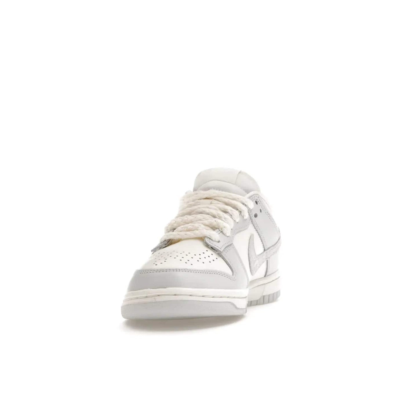 Nike Dunk Low Needlework Sail Aura (Women's) - Image 12 - Only at www.BallersClubKickz.com - Discover the Nike Dunk Low Needlework Sail Aura for Women. Boasting a beautiful Sail and Neutral Grey upper, this stylish sneaker offers durable materials with ultra-soft cushioning for all-day comfort. Get your pair today!