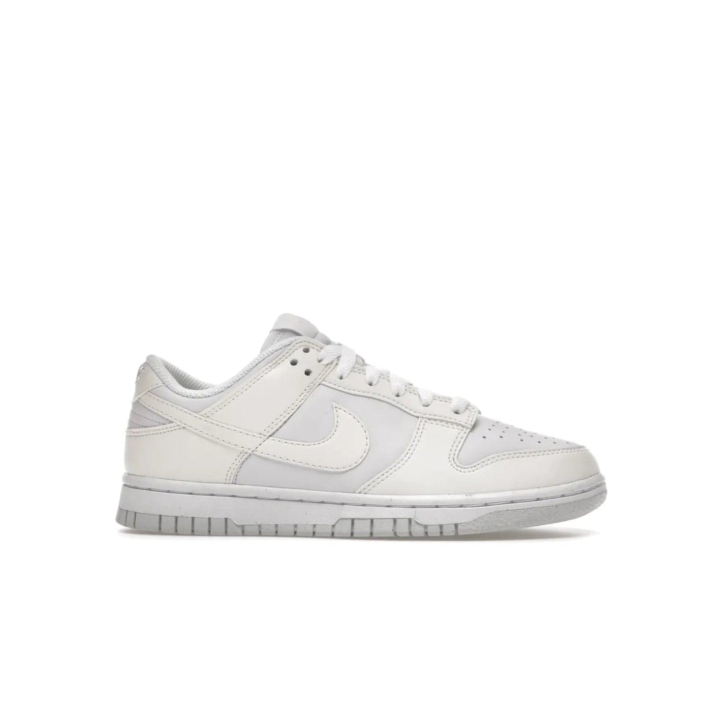 Nike Dunk Low Next Nature Sail (Women's) - Image 2 - Only at www.BallersClubKickz.com - The Nike Dunk Low Next Nature Sail delivers iconic style with sustainable innovation. This two-tone black and white Flyleather upper, constructed with 50% recycled materials, offers a stylish yet eco-friendly look. Available November 2021 for $100.