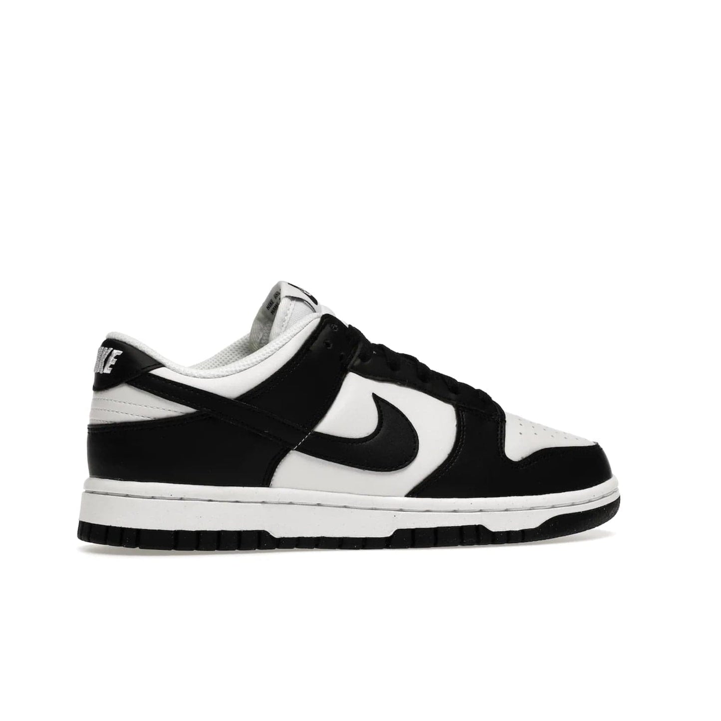 Nike Dunk Low Next Nature White Black Panda (Women's) - Image 35 - Only at www.BallersClubKickz.com - Experience sustainable fashion with the Women's Nike Dunk Low Next Nature White Black. Made with 50% recycled materials, this shoe offers a two-tone black and white Flyleather upper, matching soles and woven tongue labels. Available in November 2021.