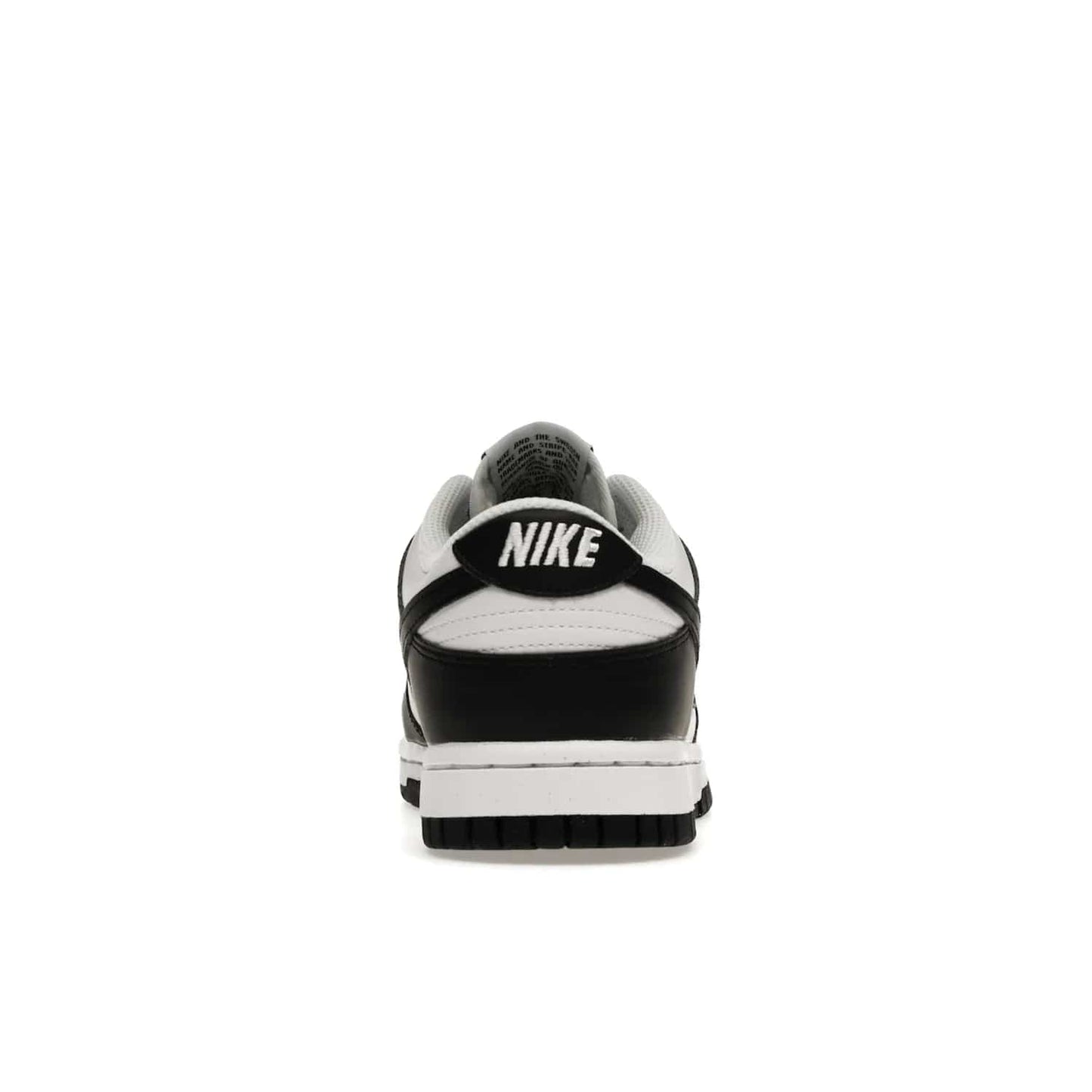 Nike Dunk Low Next Nature White Black Panda (Women's) - Image 28 - Only at www.BallersClubKickz.com - Experience sustainable fashion with the Women's Nike Dunk Low Next Nature White Black. Made with 50% recycled materials, this shoe offers a two-tone black and white Flyleather upper, matching soles and woven tongue labels. Available in November 2021.
