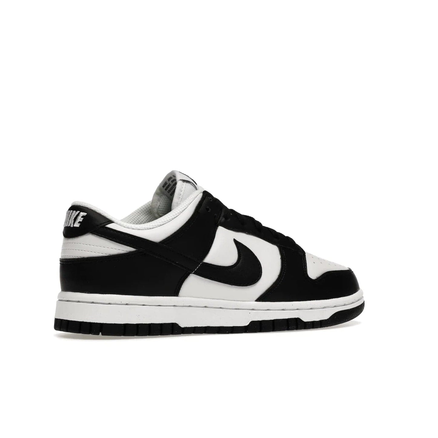 Nike Dunk Low Next Nature White Black Panda (Women's) - Image 34 - Only at www.BallersClubKickz.com - Experience sustainable fashion with the Women's Nike Dunk Low Next Nature White Black. Made with 50% recycled materials, this shoe offers a two-tone black and white Flyleather upper, matching soles and woven tongue labels. Available in November 2021.