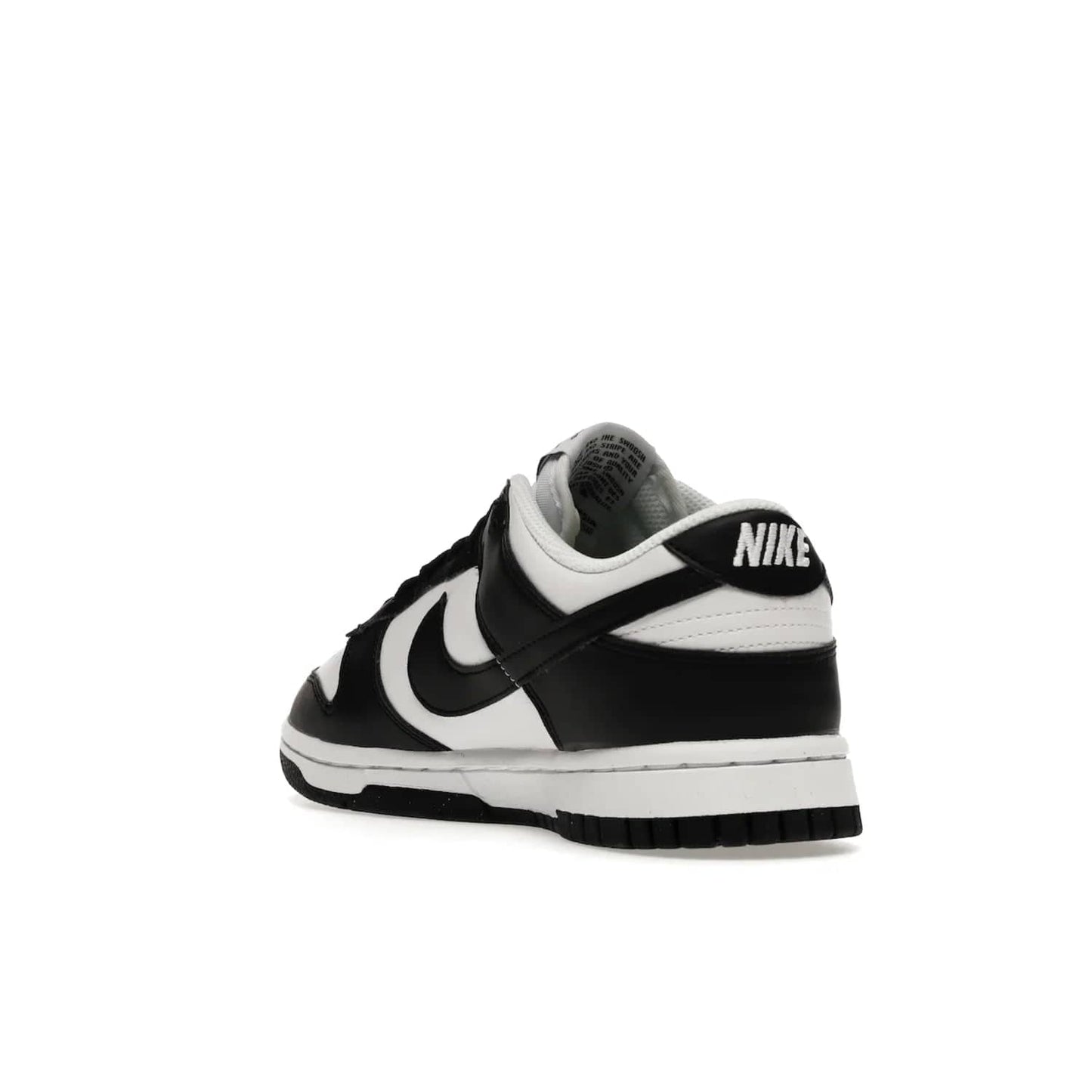 Nike Dunk Low Next Nature White Black Panda (Women's) - Image 25 - Only at www.BallersClubKickz.com - Experience sustainable fashion with the Women's Nike Dunk Low Next Nature White Black. Made with 50% recycled materials, this shoe offers a two-tone black and white Flyleather upper, matching soles and woven tongue labels. Available in November 2021.
