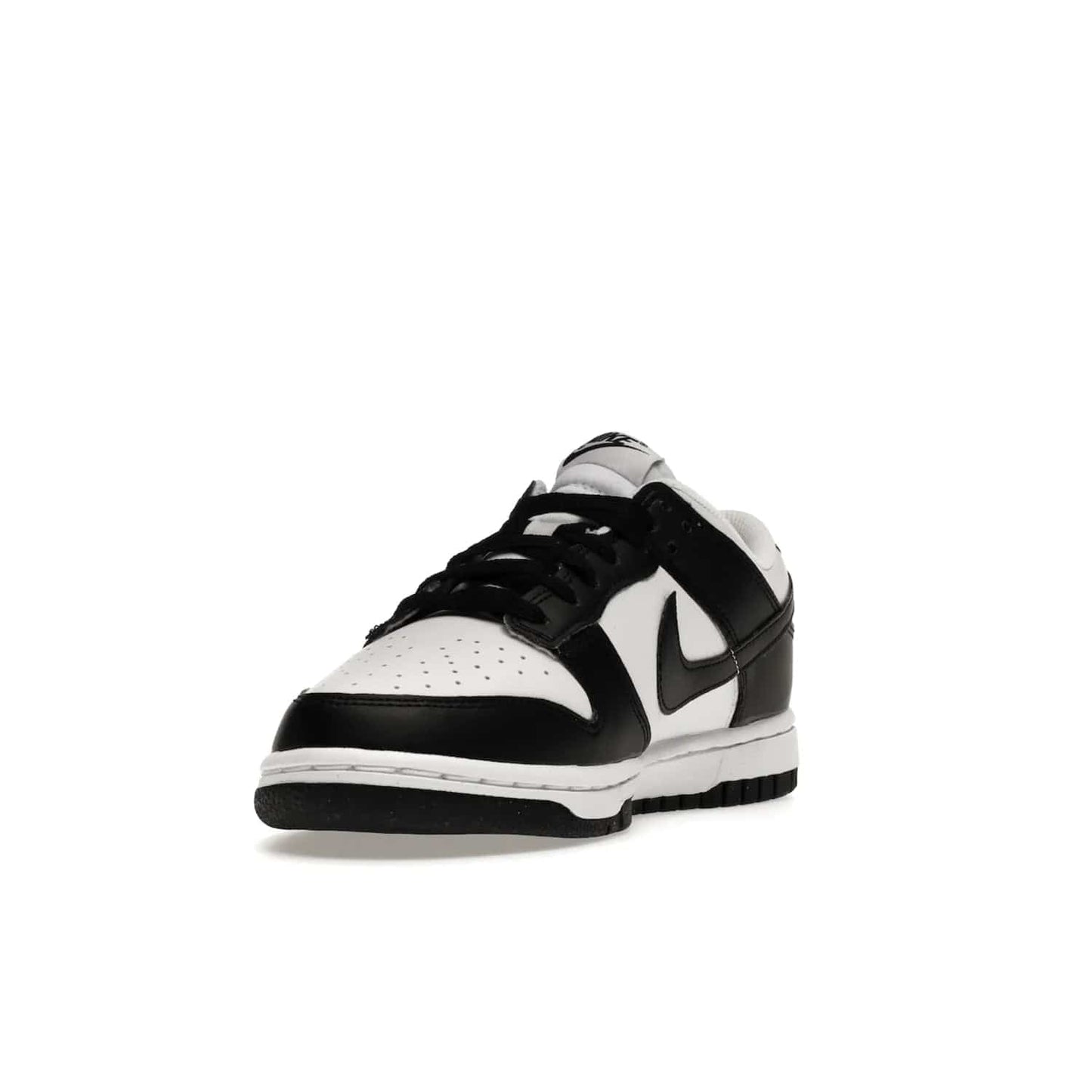 Nike Dunk Low Next Nature White Black Panda (Women's) - Image 13 - Only at www.BallersClubKickz.com - Experience sustainable fashion with the Women's Nike Dunk Low Next Nature White Black. Made with 50% recycled materials, this shoe offers a two-tone black and white Flyleather upper, matching soles and woven tongue labels. Available in November 2021.