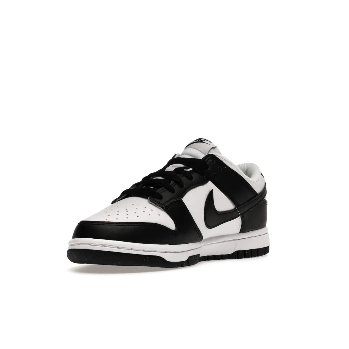 Nike Dunk Low Next Nature White Black Panda (Women's) - Image 14 - Only at www.BallersClubKickz.com - Experience sustainable fashion with the Women's Nike Dunk Low Next Nature White Black. Made with 50% recycled materials, this shoe offers a two-tone black and white Flyleather upper, matching soles and woven tongue labels. Available in November 2021.