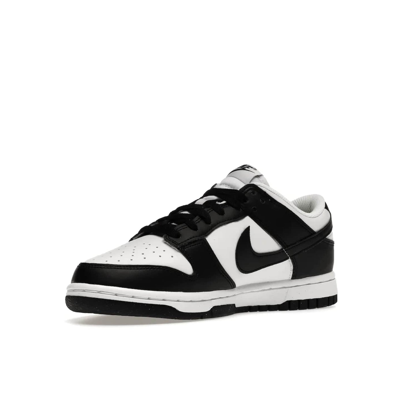 Nike Dunk Low Next Nature White Black Panda (Women's) - Image 15 - Only at www.BallersClubKickz.com - Experience sustainable fashion with the Women's Nike Dunk Low Next Nature White Black. Made with 50% recycled materials, this shoe offers a two-tone black and white Flyleather upper, matching soles and woven tongue labels. Available in November 2021.
