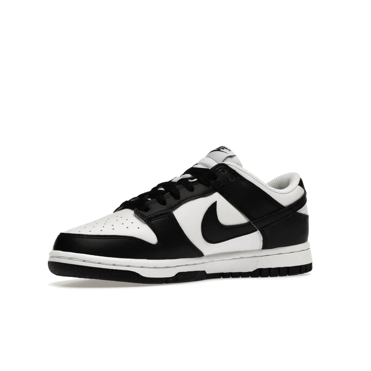 Nike Dunk Low Next Nature White Black Panda (Women's) - Image 16 - Only at www.BallersClubKickz.com - Experience sustainable fashion with the Women's Nike Dunk Low Next Nature White Black. Made with 50% recycled materials, this shoe offers a two-tone black and white Flyleather upper, matching soles and woven tongue labels. Available in November 2021.