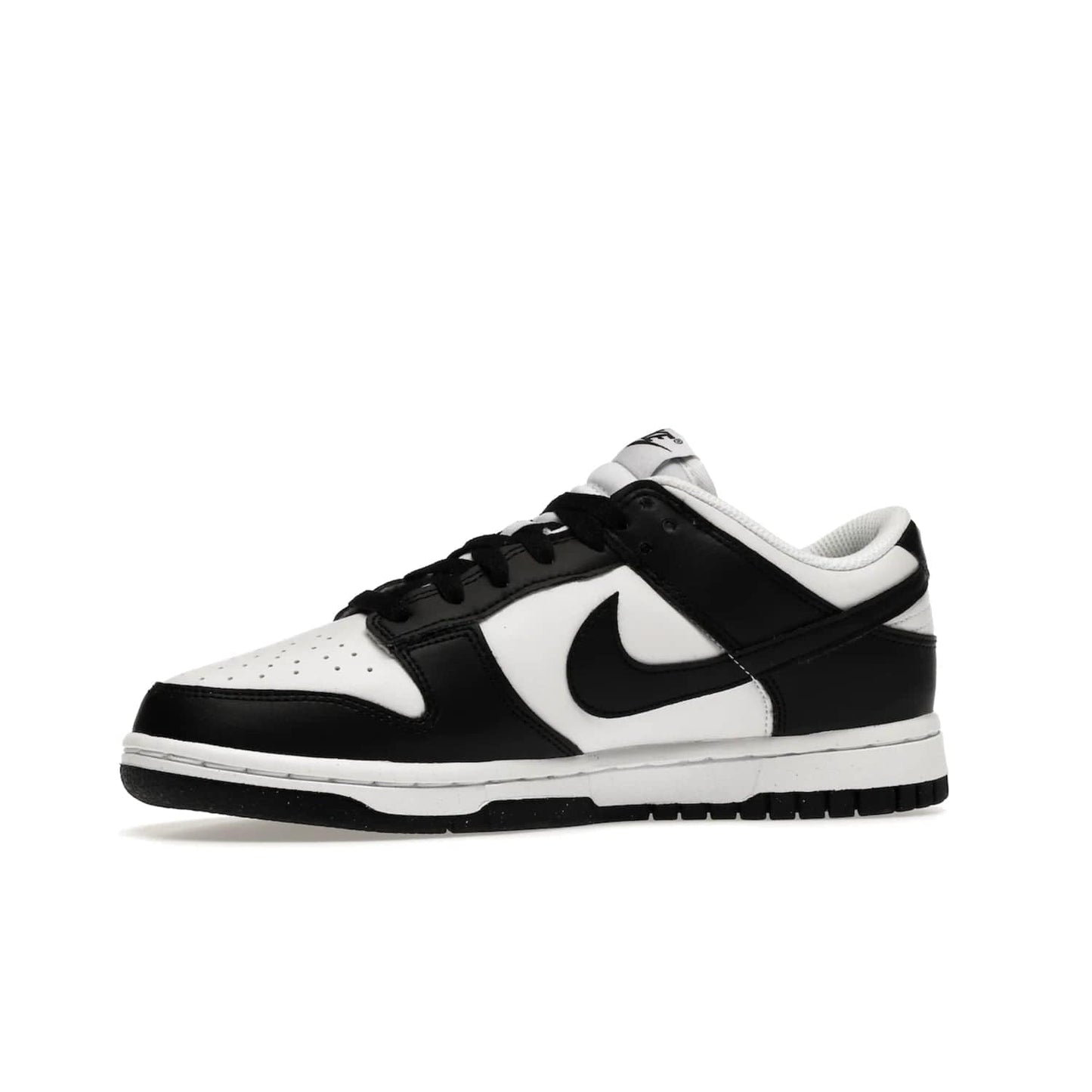 Nike Dunk Low Next Nature White Black Panda (Women's) - Image 17 - Only at www.BallersClubKickz.com - Experience sustainable fashion with the Women's Nike Dunk Low Next Nature White Black. Made with 50% recycled materials, this shoe offers a two-tone black and white Flyleather upper, matching soles and woven tongue labels. Available in November 2021.
