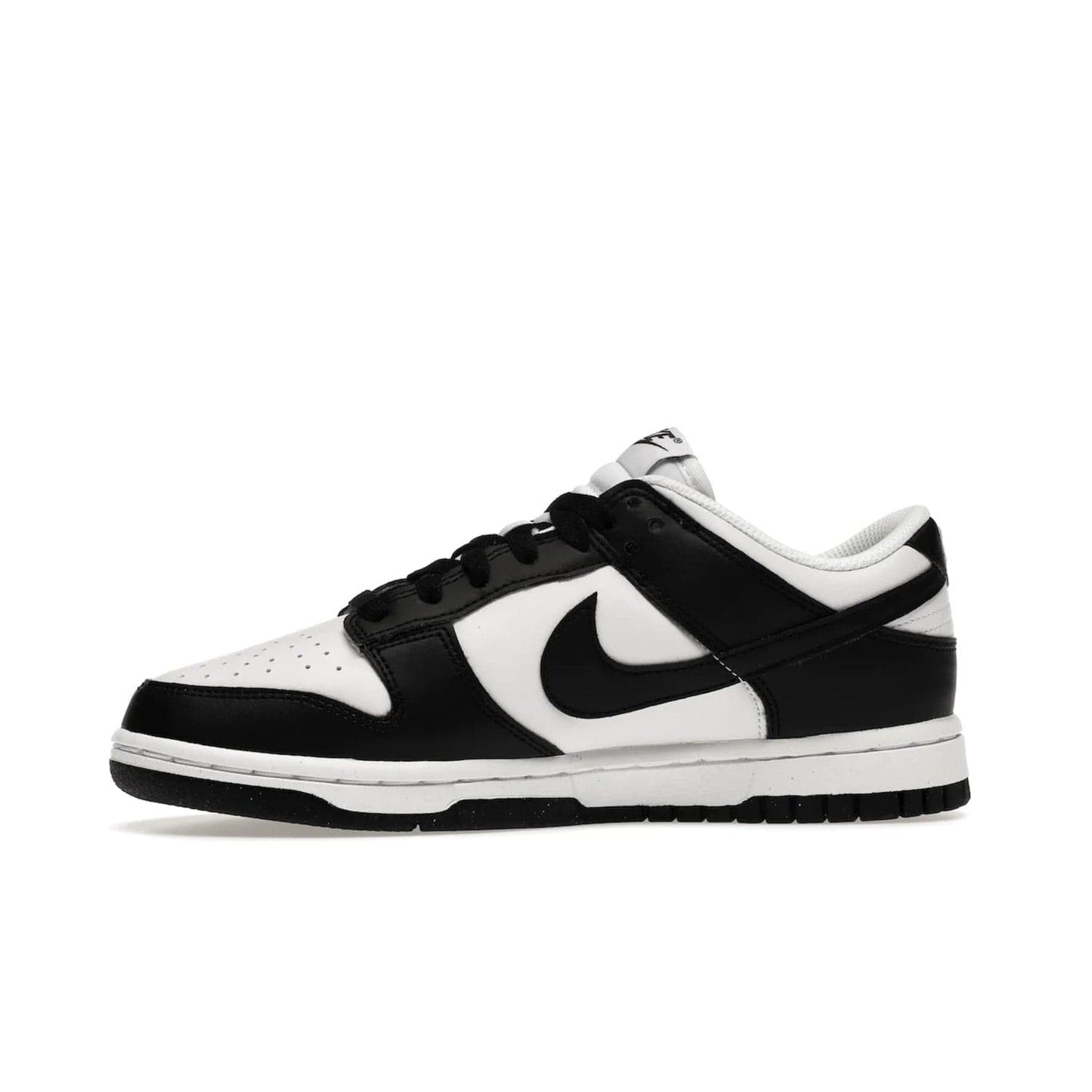 Nike Dunk Low Next Nature White Black Panda (Women's) - Image 18 - Only at www.BallersClubKickz.com - Experience sustainable fashion with the Women's Nike Dunk Low Next Nature White Black. Made with 50% recycled materials, this shoe offers a two-tone black and white Flyleather upper, matching soles and woven tongue labels. Available in November 2021.