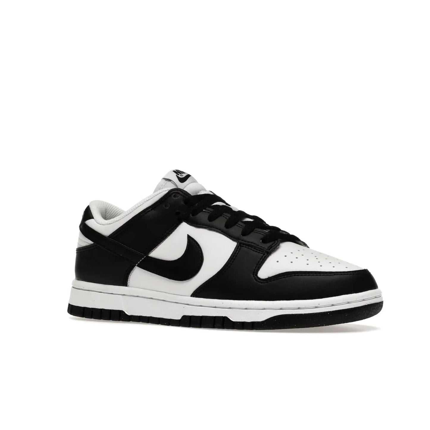 Nike Dunk Low Next Nature White Black Panda (Women's) - Image 4 - Only at www.BallersClubKickz.com - Experience sustainable fashion with the Women's Nike Dunk Low Next Nature White Black. Made with 50% recycled materials, this shoe offers a two-tone black and white Flyleather upper, matching soles and woven tongue labels. Available in November 2021.