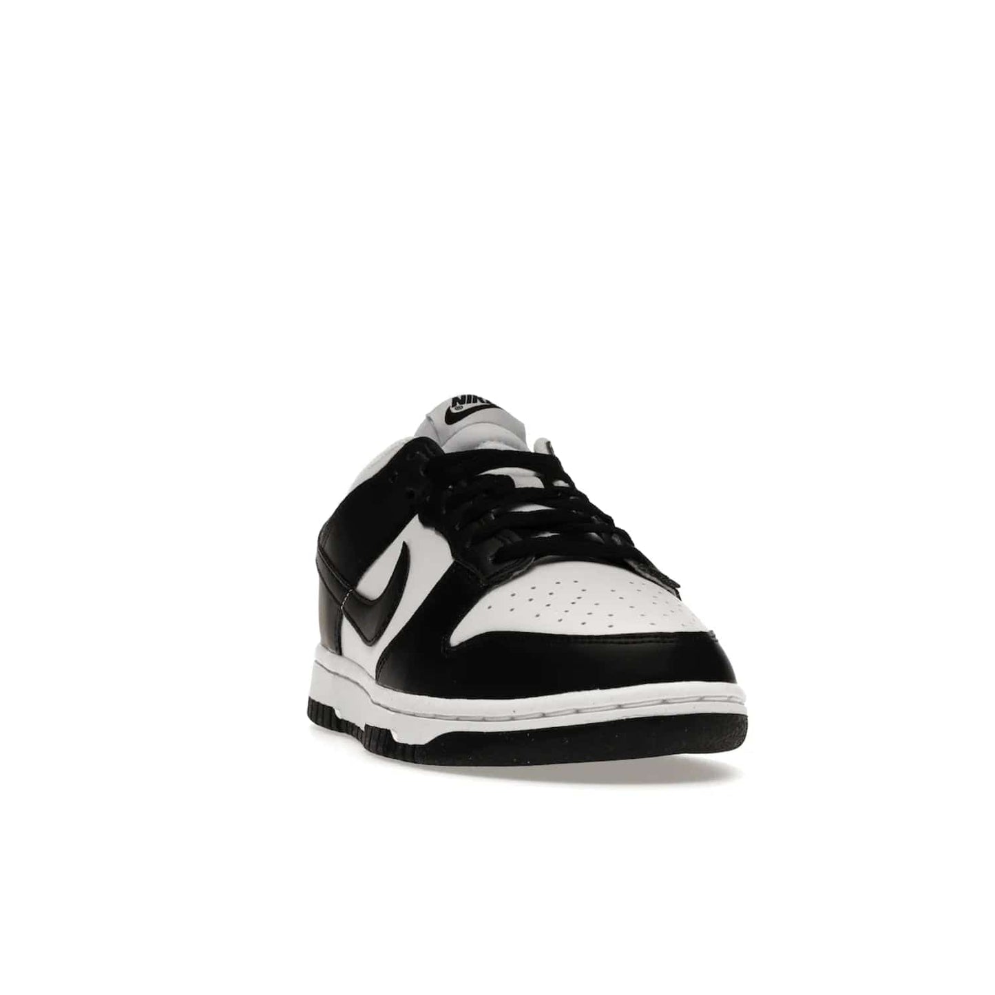 Nike Dunk Low Next Nature White Black Panda (Women's) - Image 8 - Only at www.BallersClubKickz.com - Experience sustainable fashion with the Women's Nike Dunk Low Next Nature White Black. Made with 50% recycled materials, this shoe offers a two-tone black and white Flyleather upper, matching soles and woven tongue labels. Available in November 2021.