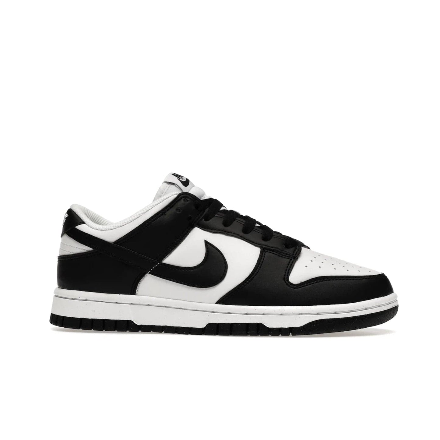 Nike Dunk Low Next Nature White Black Panda (Women's) - Image 2 - Only at www.BallersClubKickz.com - Experience sustainable fashion with the Women's Nike Dunk Low Next Nature White Black. Made with 50% recycled materials, this shoe offers a two-tone black and white Flyleather upper, matching soles and woven tongue labels. Available in November 2021.