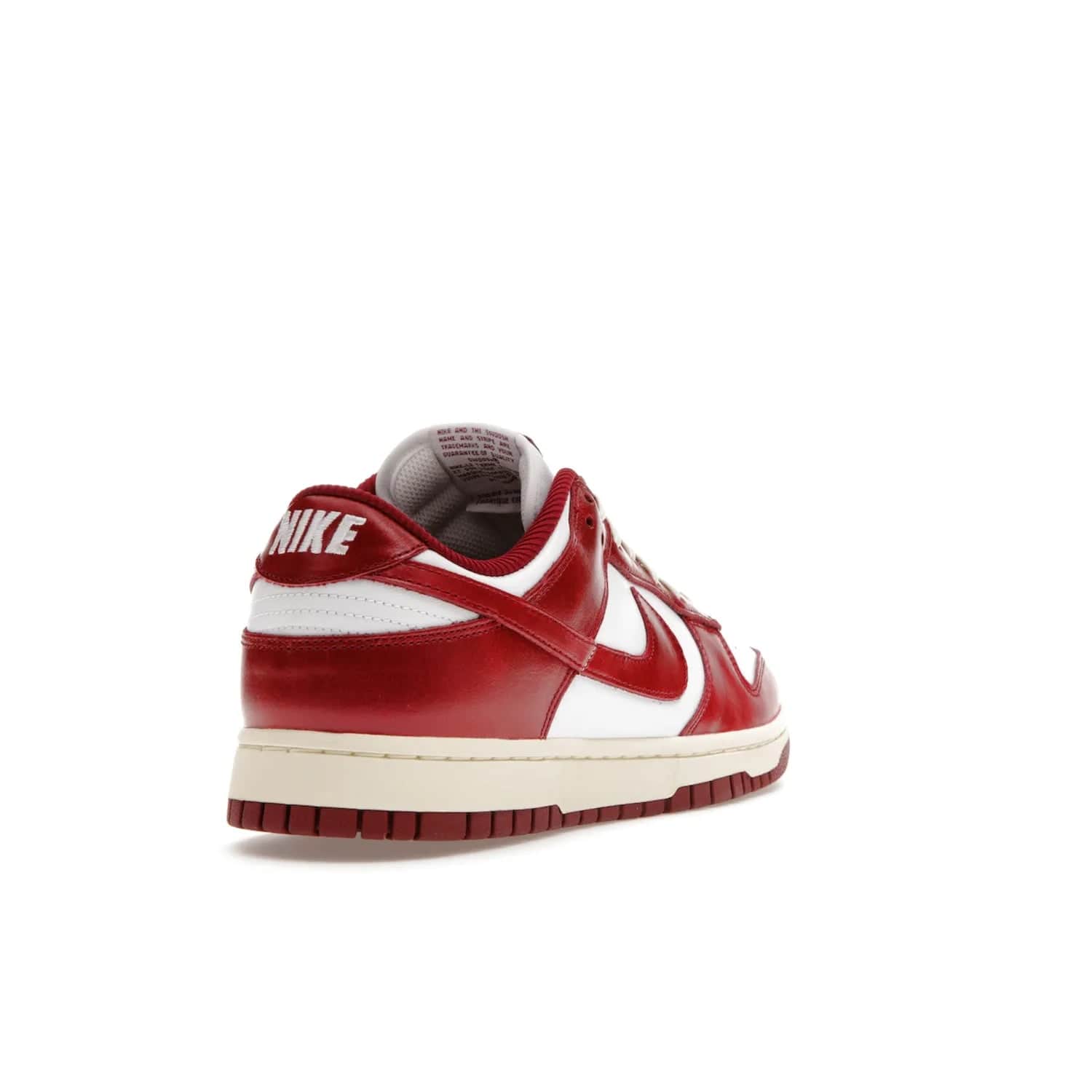 Nike Dunk Low PRM Vintage Team Red (Women's) - Image 31 - Only at www.BallersClubKickz.com - Shop the stylish Nike Dunk Low PRM Vintage Team Red. Signature Red and White leather with Coconut Milk midsoles for an aged finish. 21 April 2023 release.