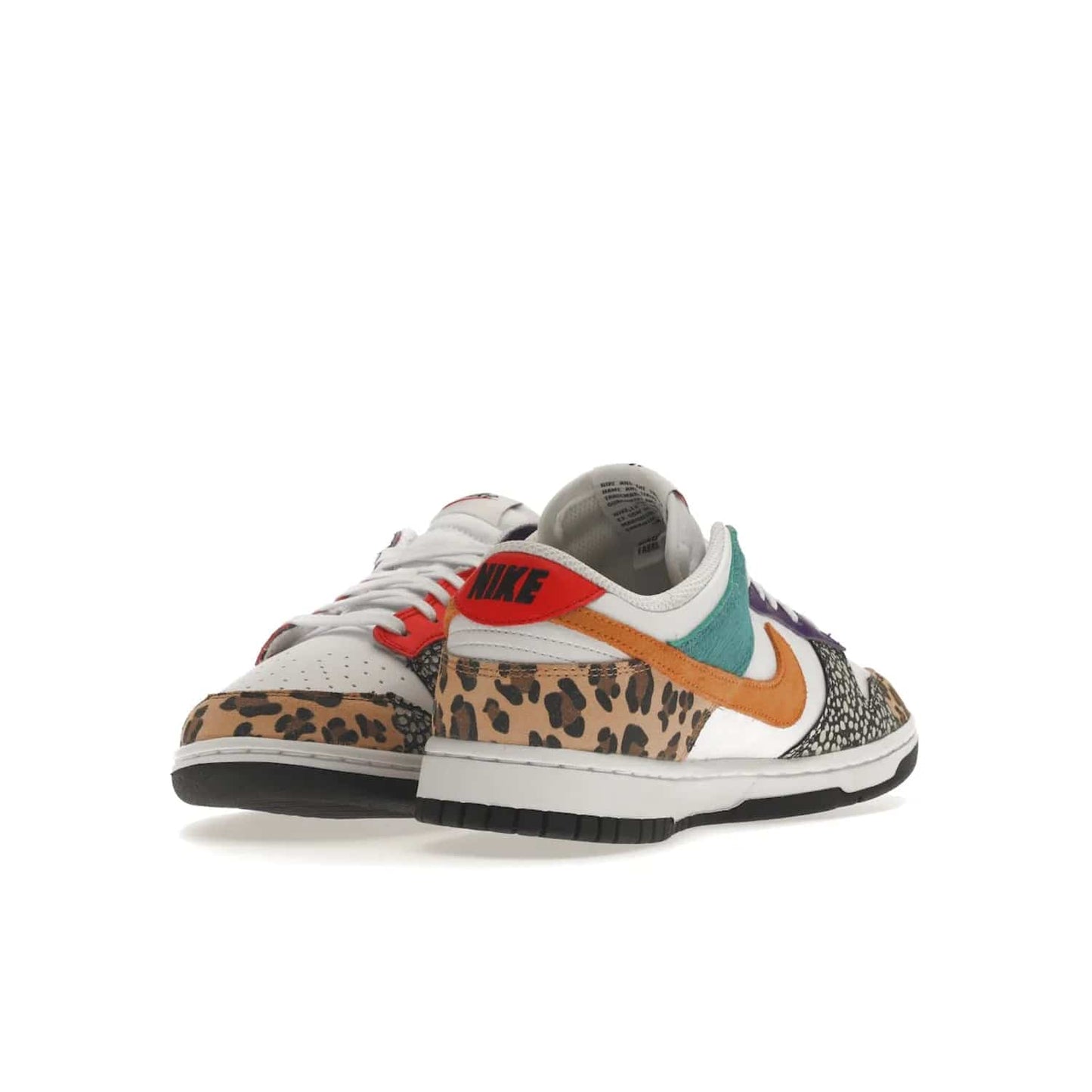 Nike Dunk Low Safari Mix (Women's) - Image 13 - Only at www.BallersClubKickz.com - Express your unique style with the Women’s Nike Dunk Low Safari Mix. Featuring a vibrant mix of white leather, leopard Durabuck, faux-horsehair, suede, and more, this stylish sneaker will turn heads. Shop now for a bold look at an affordable $120 price tag. Available in May 2022.