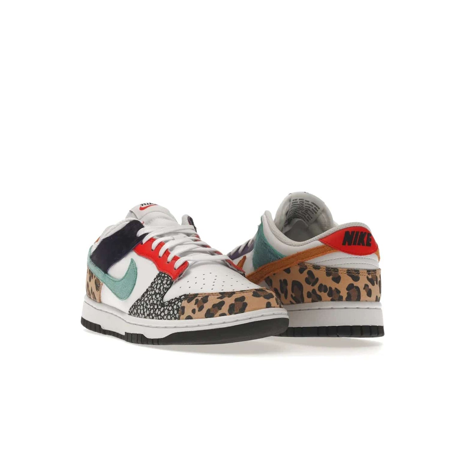 Nike Dunk Low Safari Mix (Women's) - Image 7 - Only at www.BallersClubKickz.com - Express your unique style with the Women’s Nike Dunk Low Safari Mix. Featuring a vibrant mix of white leather, leopard Durabuck, faux-horsehair, suede, and more, this stylish sneaker will turn heads. Shop now for a bold look at an affordable $120 price tag. Available in May 2022.