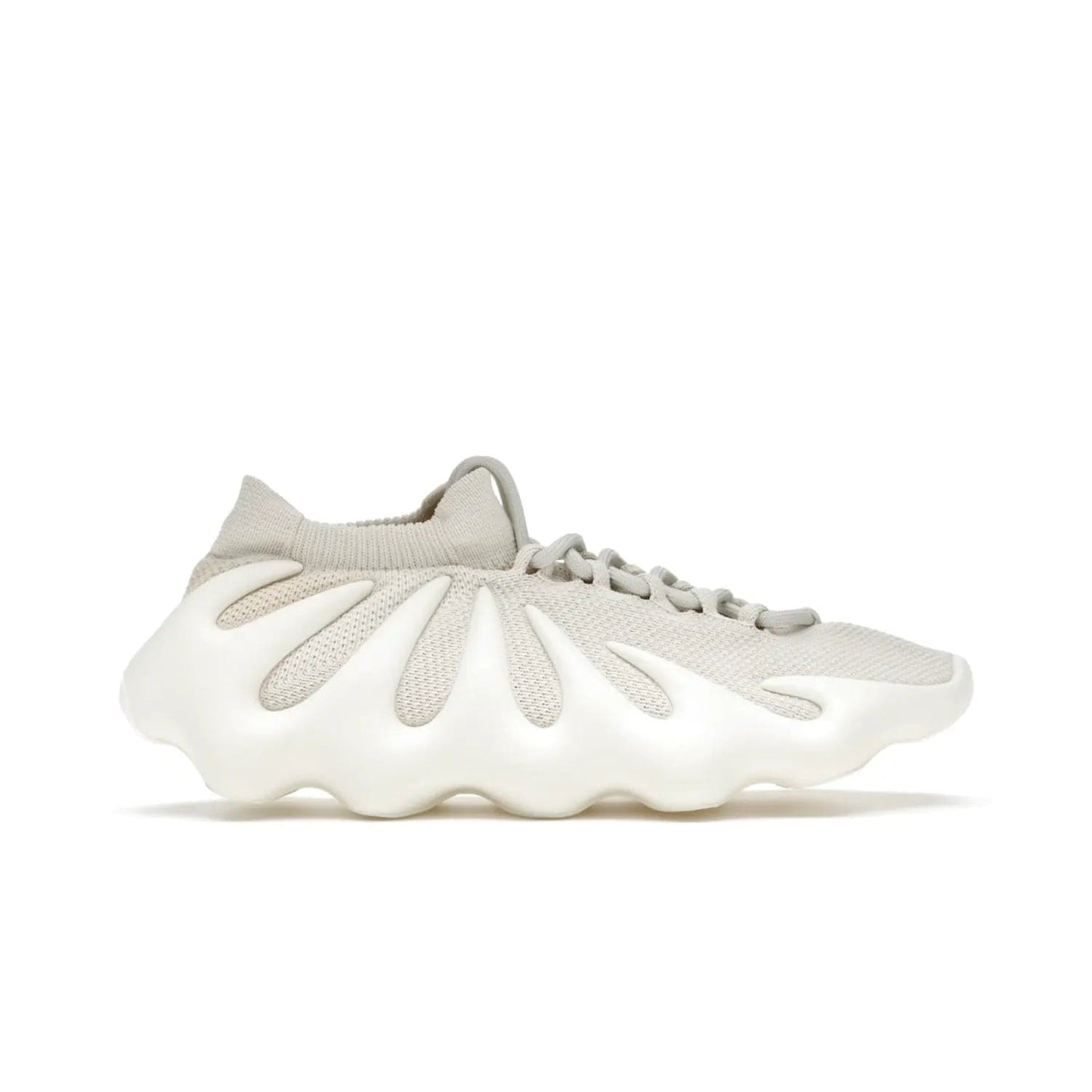 adidas Yeezy 450 Cloud White - Image 1 - Only at www.BallersClubKickz.com - Experience the future with the adidas Yeezy 450 Cloud White. A two-piece design featuring an extreme foam sole and mesh upper, this silhouette is expected to release in March 2021. Get your hands on this striking Cloud White/Cloud White colorway and stand out in the crowd.