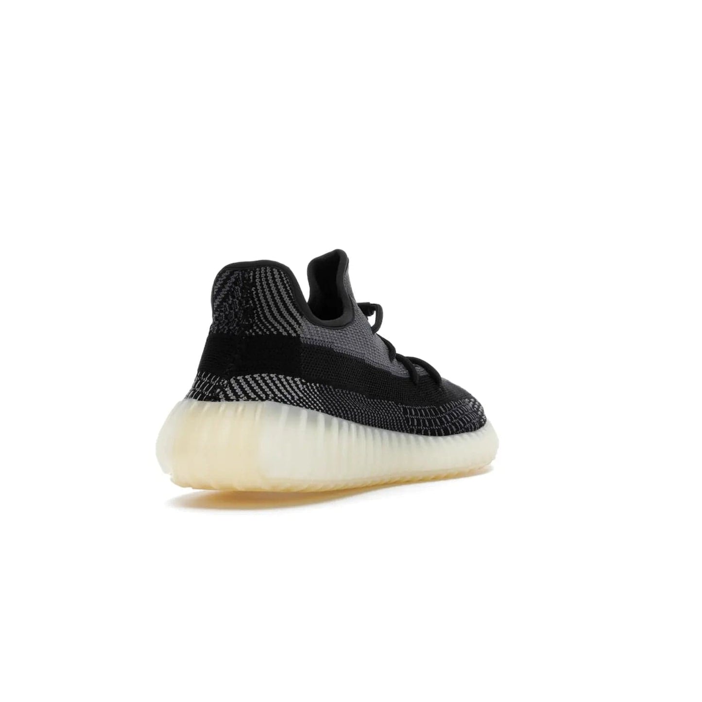 adidas Yeezy Boost 350 V2 Carbon - Image 31 - Only at www.BallersClubKickz.com - Introducing the adidas Yeezy Boost 350 V2 Carbon. Iconic sneaker with a dark-hued upper, breathable Primeknit mesh, signature side stripe, off-white midsole & BOOST cushioning. Perfect for any sneaker lover. Released October 2020.