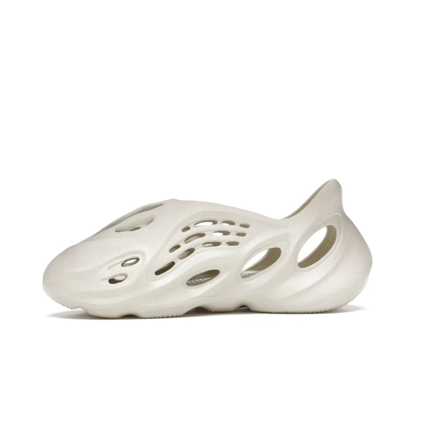 adidas Yeezy Foam RNNR Sand - Image 18 - Only at www.BallersClubKickz.com - Adidas Yeezy Foam RNNR Sand combines style and comfort for the perfect everyday sneaker. Monochromatic Sand upper, foam midsole, rubber outsole, and oval cut-outs for a modern look. Lacing system ensures foot stays secure. Elevate any outfit with style.